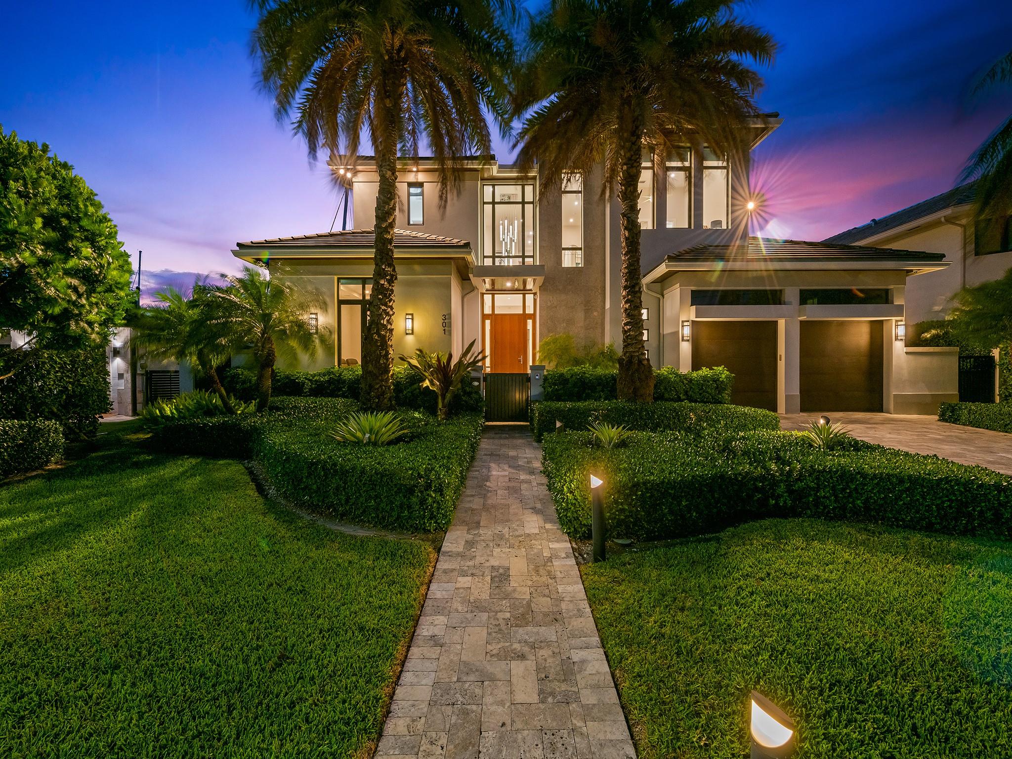 The twilight hour illuminates this home creating a serene and captivating nighttime ambiance.