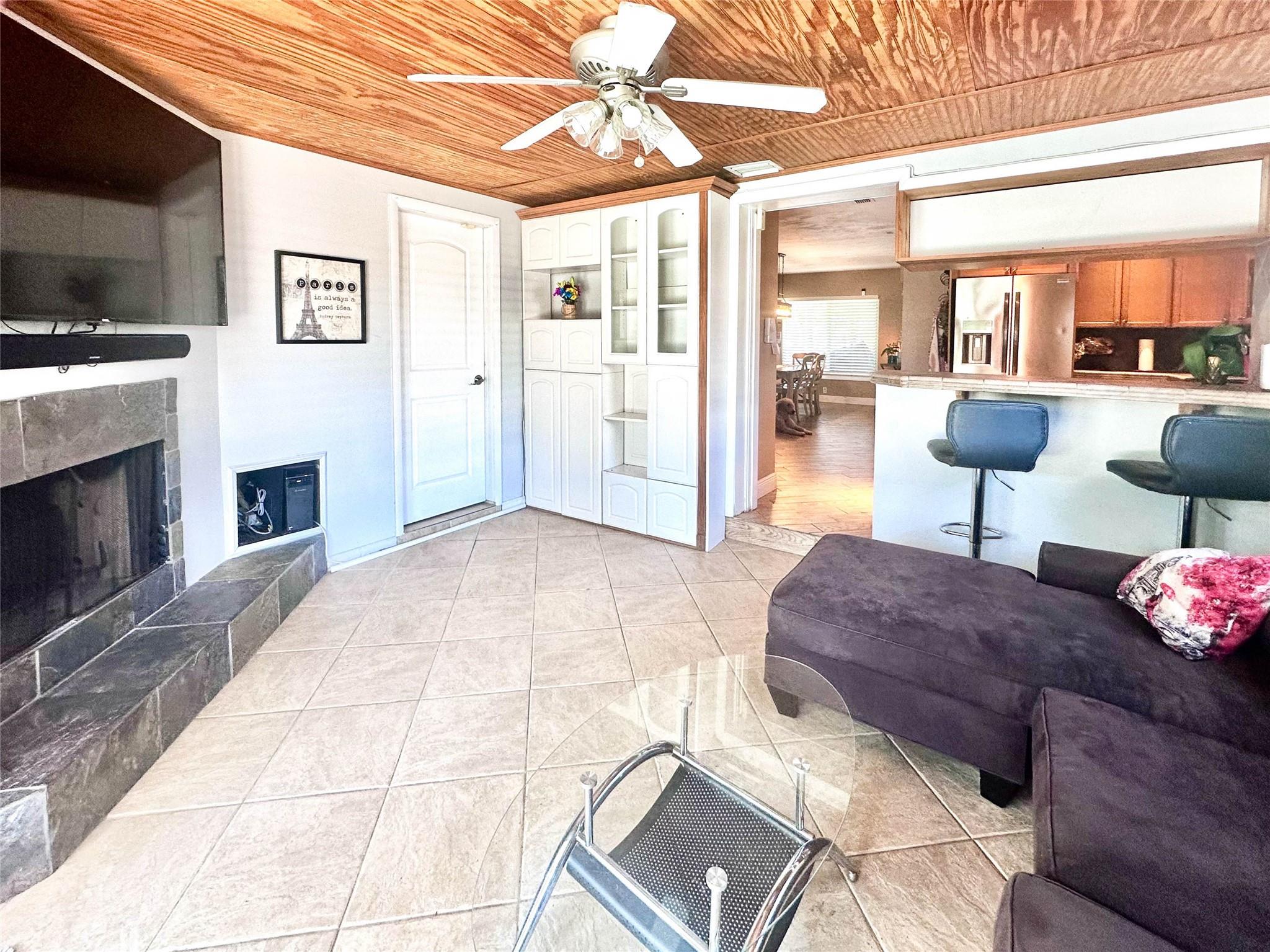 Real wood burning fireplace in family room.