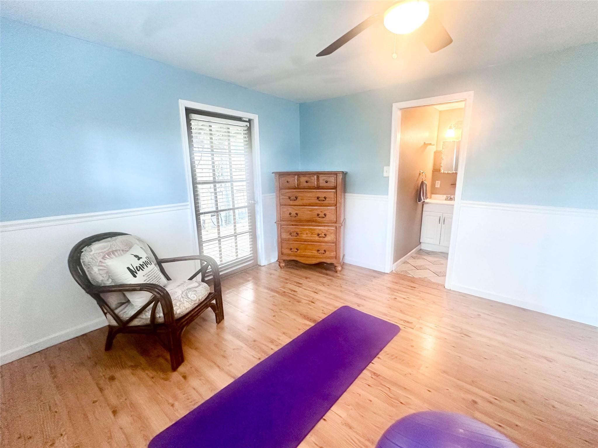 bedroom with exterior entrance and ensuite bathroom