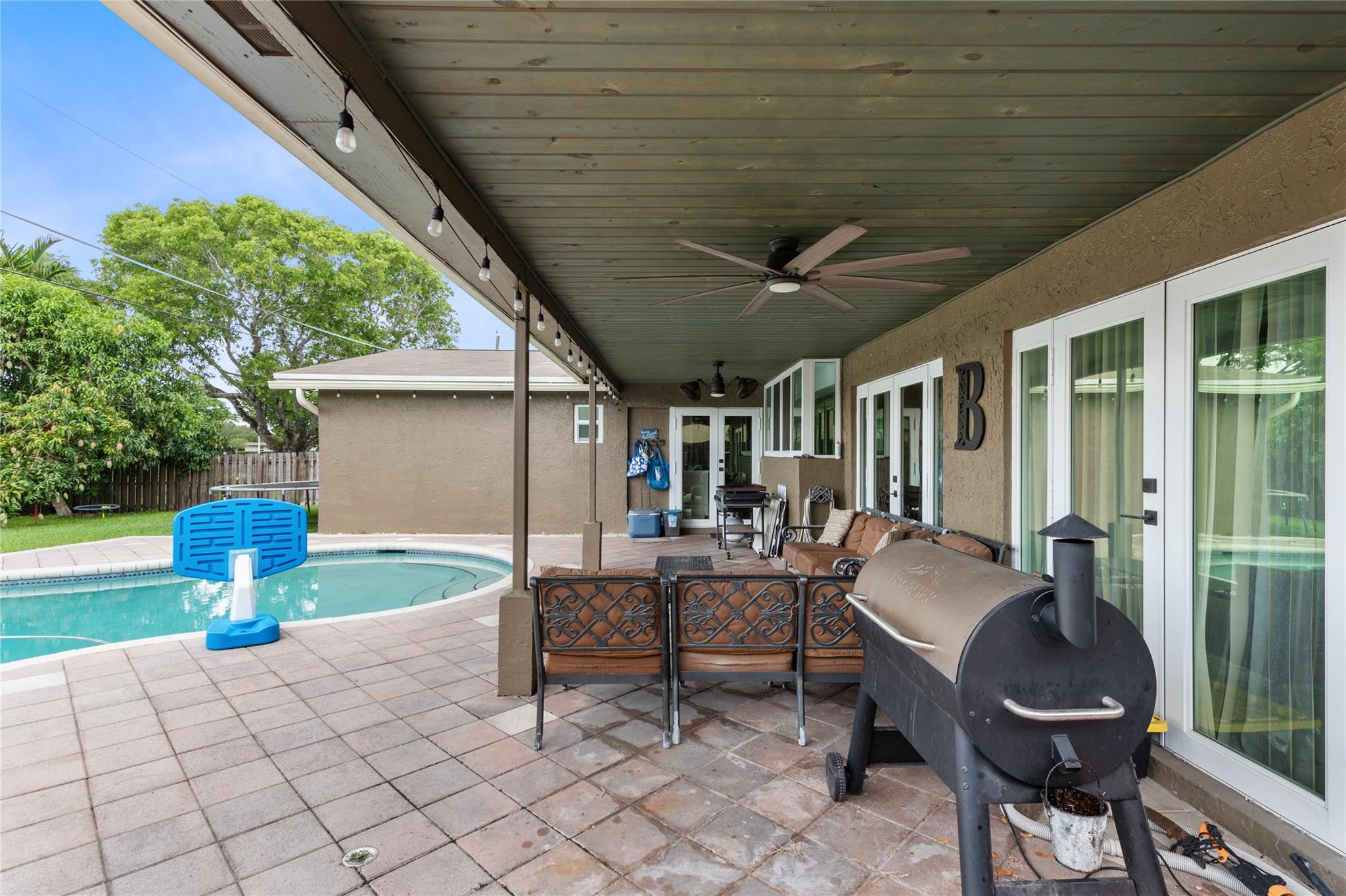 Back covered patio, pool and back yard