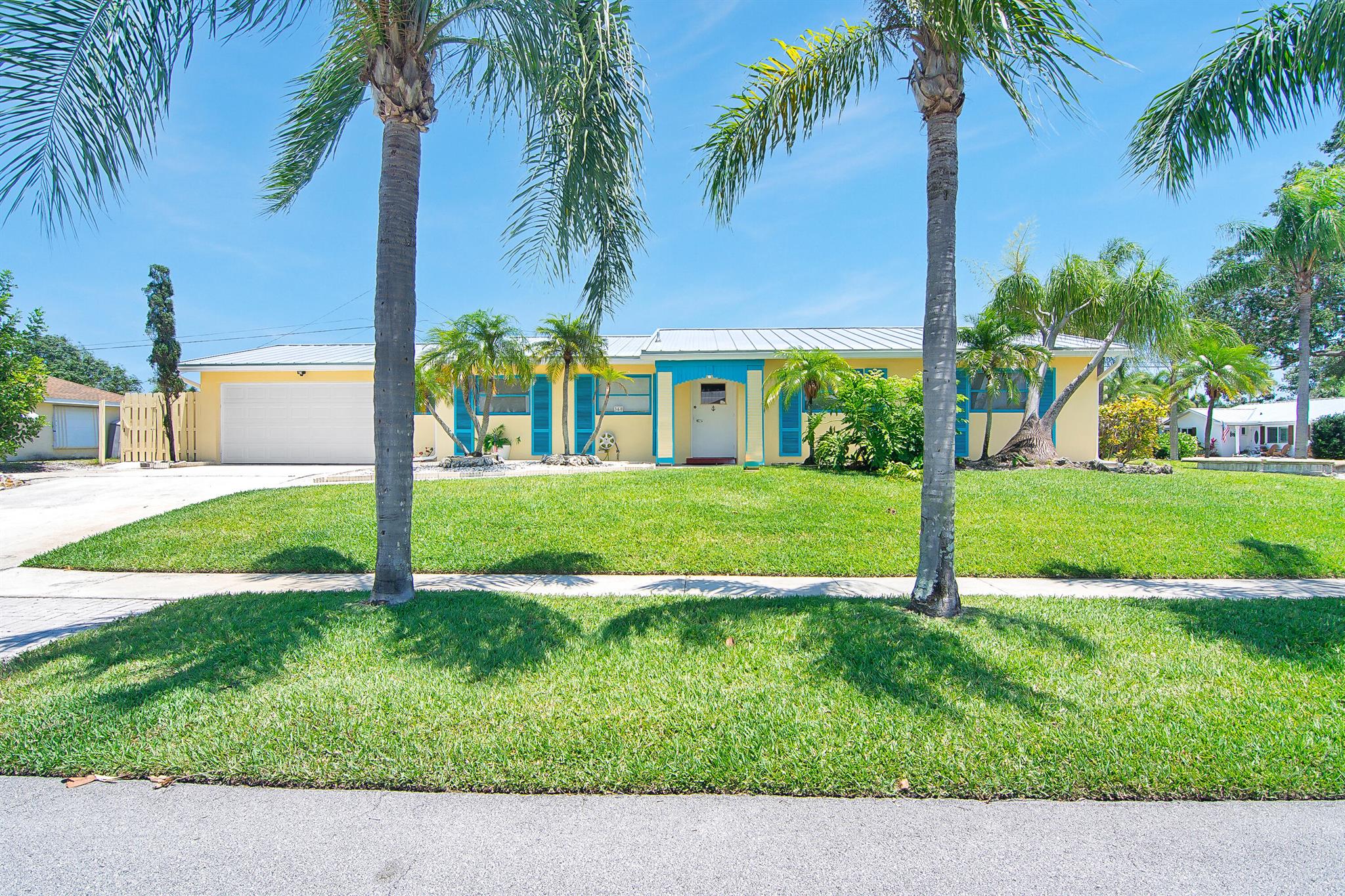 Price Adjusted! Seller Motivated! Welcome to this home situated in the heart of Tequesta. This charming 2 bedroom/2 bath home features a roof installed in 2024, AC in 2024, exterior painted in 2024 and interior freshly painted in 2025. Please check document section for rendering of a potential 10.5 x 11, 3rd bedroom.  Nestled on a high and dry, corner lot this home has a fenced yard and a private pool. The oversized 2 car garage has a new beltless garage door,2025, and a  rear door large enough for a boat to be parked in the additional space in the rear of the home. The spacious interior is all tile, no carpet and the two bedroom suites both have bathrooms ensuite. Located in highly desirable Tequesta this home is waiting for you to update this home and make it yours.