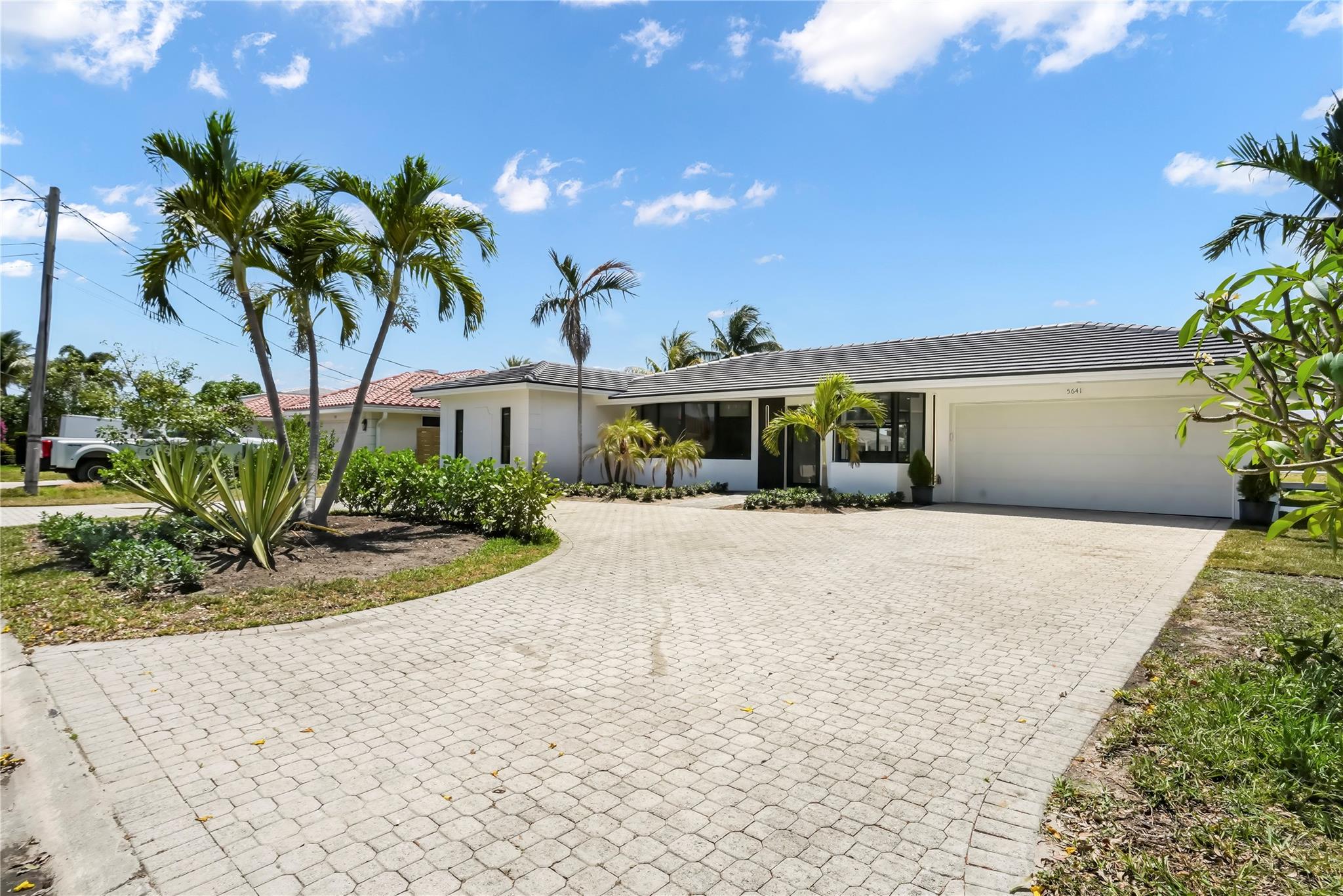 circular driveway parks 8 car plus a 2-car garage