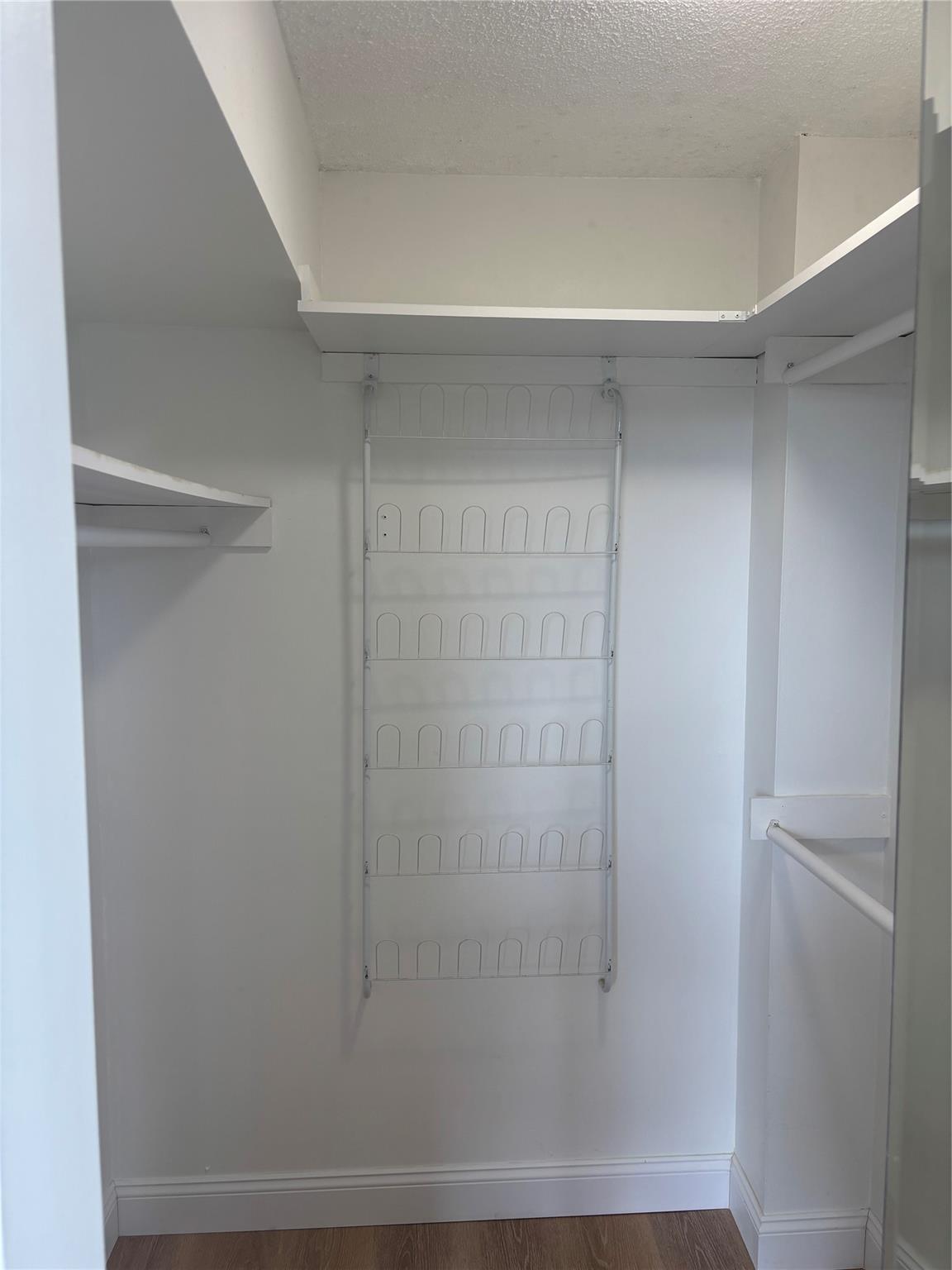 Walk-in closet in primary bedroom