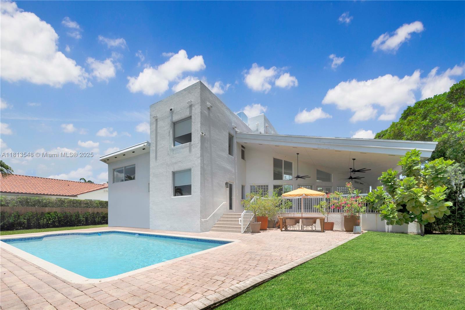 Casa Delfin is a move-in ready dream home, currently configured as a 5-bedroom, 5-bath residence 
Features elegant terrazzo and marble flooring, while the second floor and third-level studio/lounge boast rich, real wood floors. Two spacious roof decks offer stunning views of both the north marina and south green landscape.
Built in 1996 and engineered to withstand hurricanes, the home blends durability with luxury. The chef’s kitchen features Cristallo quartzite countertops, a Wolf induction stove, Sub-Zero refrigerator, and its own cozy lounge area with a custom-built dining nook. Additional highlights include updated bathrooms, a large backyard with a pool and  includes access to the marina and 8 deeded docks.
Located in a private, gated community with its own park.