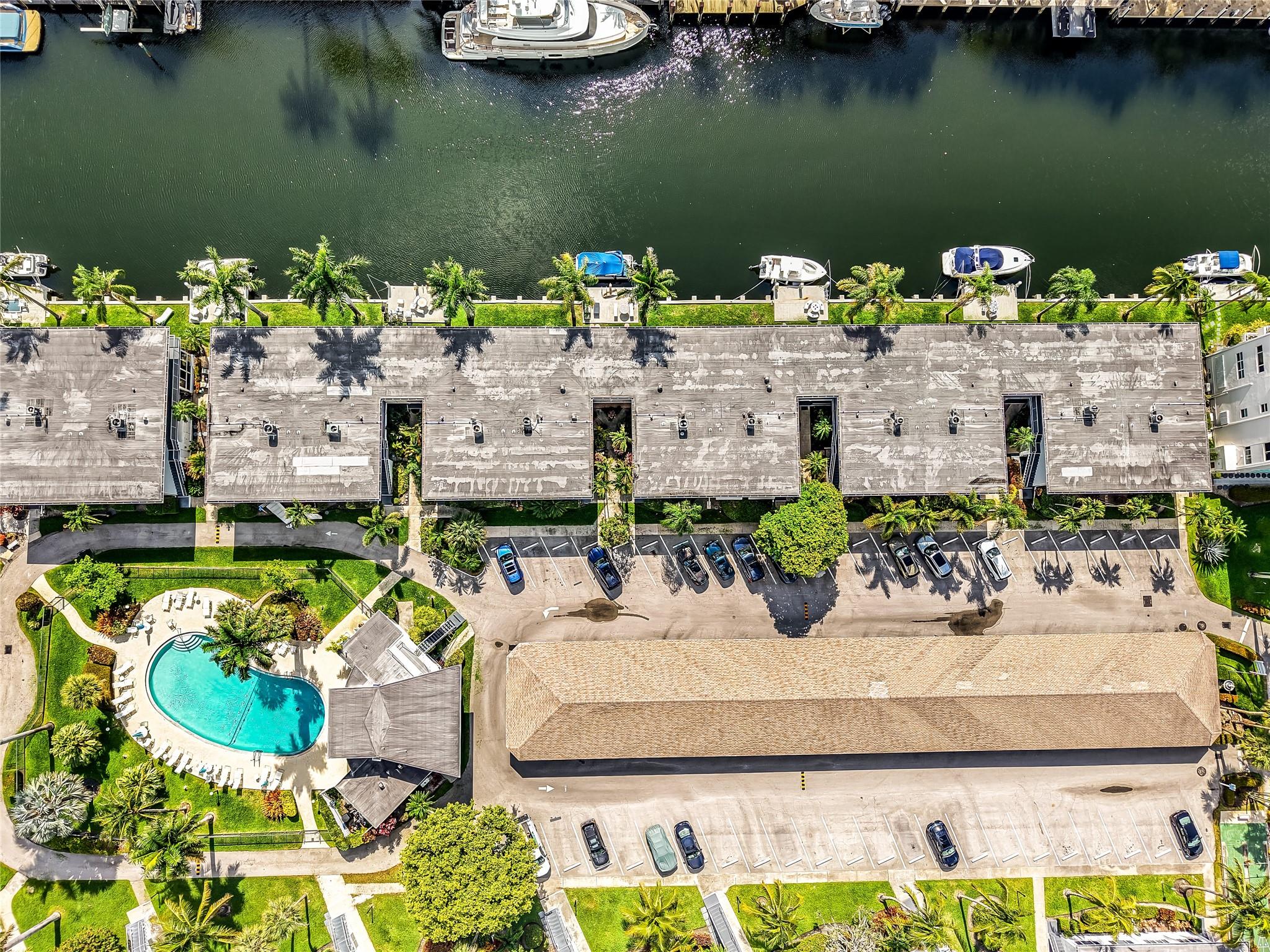 Live the Las Olas waterfront lifestyle in this beautifully renovated, fully furnished 2/2 with deep water ocean access—no fixed bridges. Dock your 35’ boat just steps from your first-floor unit and cruise to the Sandbar in 15 mins, Port Everglades in 20. Enjoy stunning, floor-to-ceiling water views from your sunroom and living room, facing a canal lined with multimillion-dollar homes. Features include impact windows, tile floors, newer AC & electrical panel, in-unit laundry room, one assigned covered parking spot, and ample guest parking. Strong reserves, financing available. Land share also available for purchase. Cheapest way to live on the Isles!