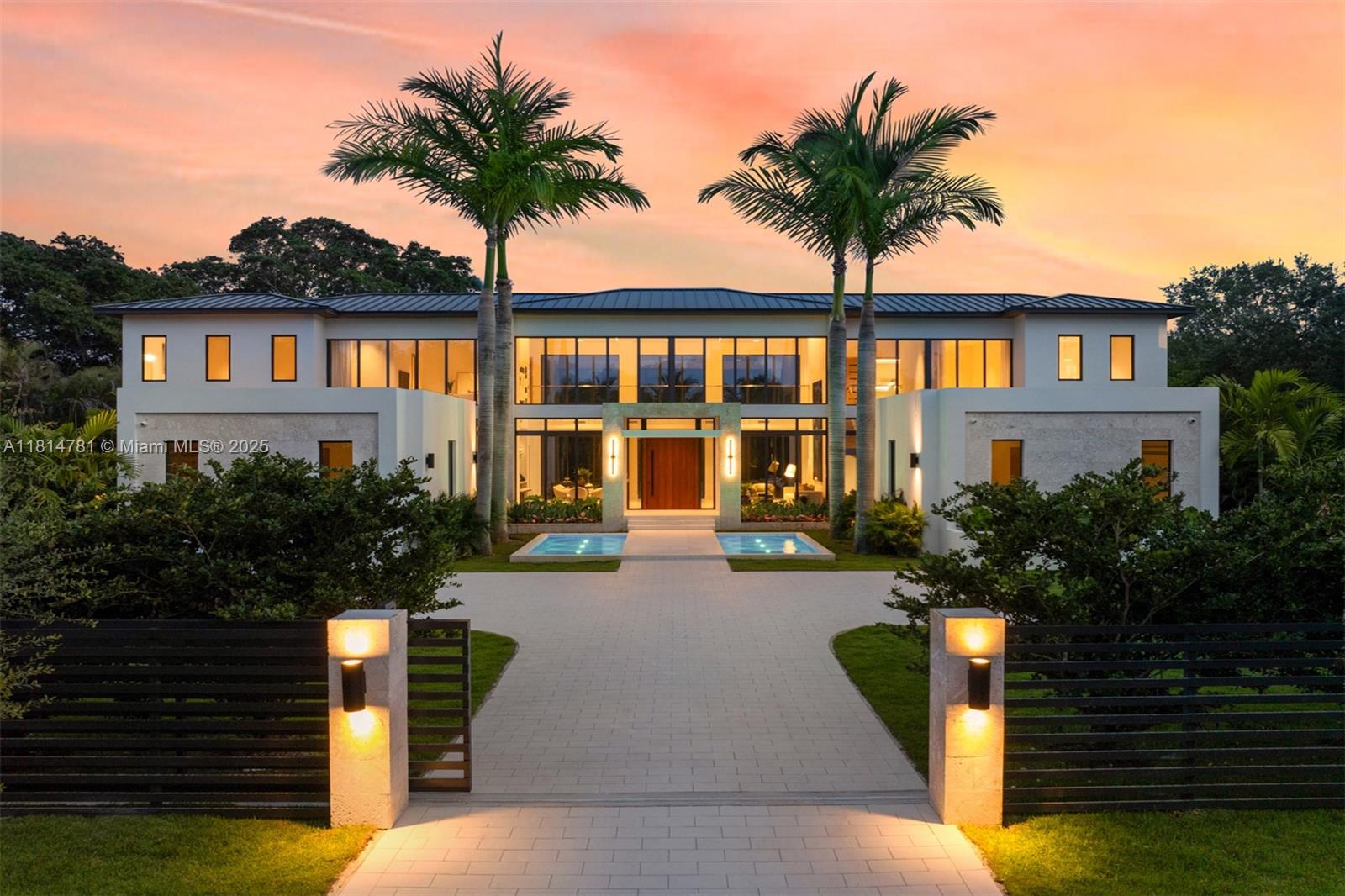 This brand-new transitional masterpiece in the heart of Pinecrest exudes sophistication and elegance. Boasting 8 bedrooms & 9.1 bathrooms across 11,375 SF, it features 2 primary suites, a home theater & a private home office. A separate guest house with a kitchenette adds flexibility for visitors or extended family. The gourmet kitchen is equipped with Subzero refrigeration, Wolf & Al Fresco appliances & custom wood cabinetry. Floor-to-ceiling windows flood the open living spaces with natural light & panoramic views. Enjoy seamless indoor-outdoor living with covered terraces, a heated pool & a summer kitchen. Smart home technology, Control4 automation, full house generator & elevator-ready design & premium finishes complete this rare opportunity to own a truly luxurious Pinecrest estate.