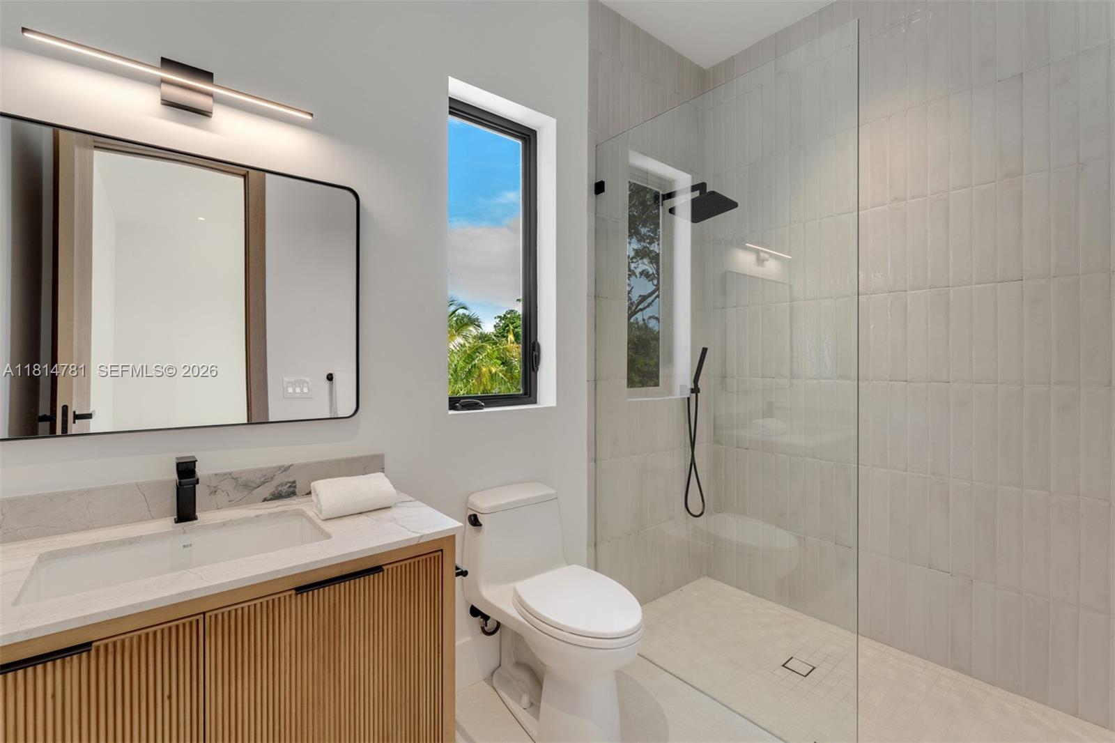 This brand-new transitional masterpiece in the heart of Pinecrest exudes sophistication and elegance. Boasting 8 bedrooms & 9.1 bathrooms across 11,375 SF, it features 2 primary suites, a home theater & a private home office. A separate guest house with a kitchenette adds flexibility for visitors or extended family. The gourmet kitchen is equipped with Subzero refrigeration, Wolf & Al Fresco appliances & custom wood cabinetry. Floor-to-ceiling windows flood the open living spaces with natural light & panoramic views. Enjoy seamless indoor-outdoor living with covered terraces, a heated pool & a summer kitchen. Smart home technology, Control4 automation, full house generator & elevator-ready design & premium finishes complete this rare opportunity to own a truly luxurious Pinecrest estate.