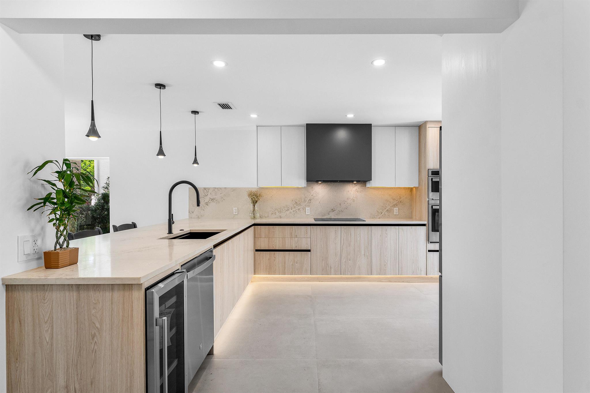 Be the first to live in this perfectly renovated corner townhouse with 4 private outdoor spaces--- 1. European style courtyard 2. backyard that can be fenced in 3. balcony off primary suite 4. balcony off 3rd bedroom. ALL NEW IMPACT WINDOWS, Roof is 2022, AC is 2021. Amazing opportunity if you are looking for  outdoor space & an abundance of natural light! Stunning large format porcelain tiles, top of the line GE appliances (including induction cooktop), smart washer/dryer combo that is $2500, countertop backsplash, workstation sink, floating master vanity, rainfall shower, SOLID WOOD DOORS, cable rail system, stunning chandelier, walk in closet, huge primary bedroom.... Too many features to list. Private showings will begin this Friday, schedule your showing today- this one won't last.