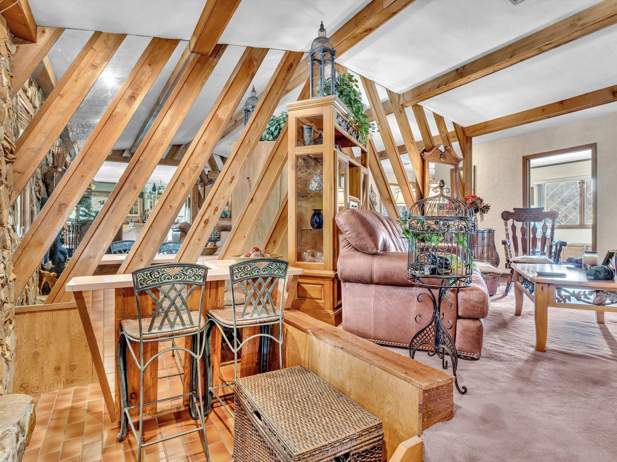 Right next to the fireplace in separate siting area in the livingroom