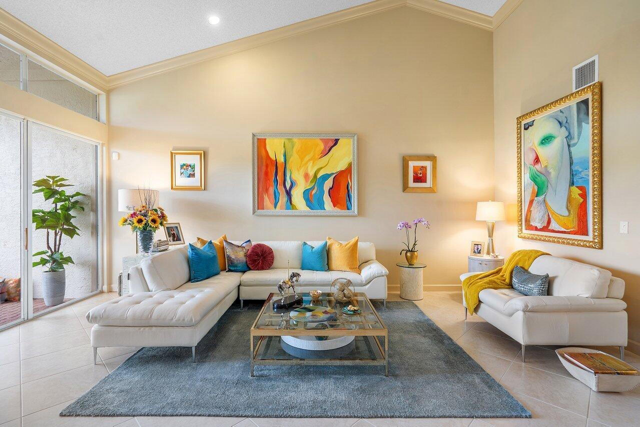 Don't miss this beautiful and inviting one-story townhome, ideally located just a short walk from the clubhouse! 3-bedroom, 2-bath, featuring a well-designed layout with volume ceilings creating a bright and airy atmosphere. Tastefully designed kitchen with abundant cabinetry for storage, and a functional layout that makes cooking a breeze. The primary suite offers a custom walk-in closet, spacious vanity with double sinks, a walk-in shower, and a separate soaking tub.Additional highlights include:  2019 new tile roof and A/C, new water heater in 2021, and newer appliances. Tile flooring and crown molding add a touch of elegance throughout the main living spaces. Plantation shutters, and access to an extended, screen-enclosed patio, are ideal for enjoying Florida living. Located in Windsor Parke within The Polo Club, Boca Raton's premier country club community, residents enjoy world-class amenities including two championship golf courses, a renowned tennis and pickleball center, state-of-the-art fitness and spa facilities, and multiple dining options.Schedule your private showing today!