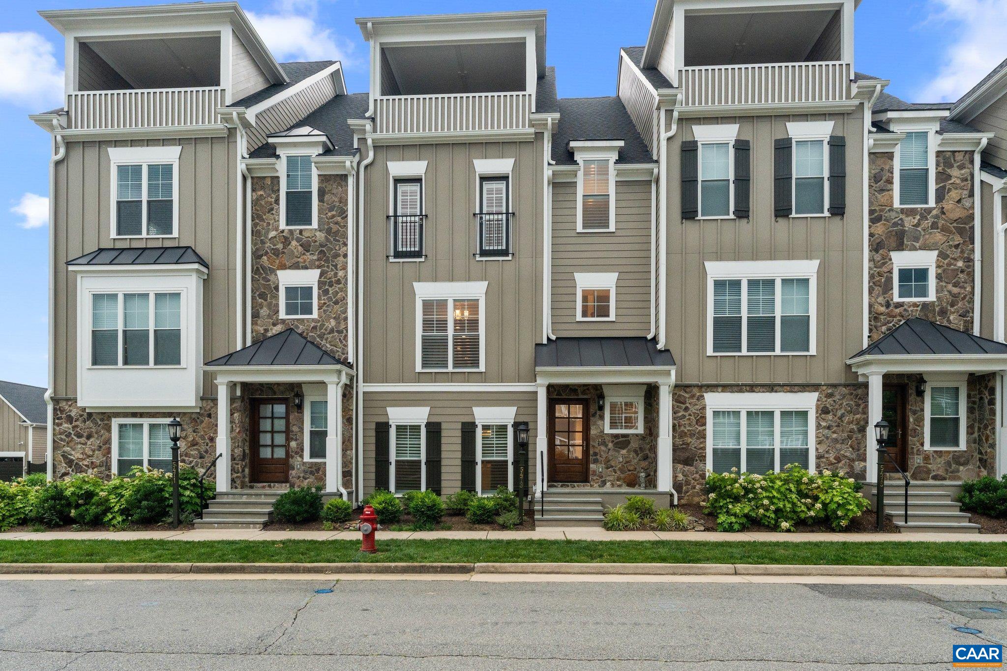 Private ELEVATOR!   Home offers FOUR fully finished levels with luxury vinyl plank flooring throughout, combining style with durability.  Entry level features a versatile bedroom complete with en-suite, that would make perfect guest suite or office, and an area to drop bags and jackets just off the garage, and your private elevator. Open and spacious main level features a light-filled living space with a gorgeous kitchen, oversized-quartz island, stainless appliances, and modern finishes. Living area centers on an electric fireplace, and access to a spacious screened porch.  Bedroom level hosts the primary suite with walk-in shower with dual shower heads, and separate water closet, an additional bedroom with ensuite, and a spacious laundry complete this level.   Enjoy a lifestyle that comes with living in Crozet’s most walkable, amenity-rich community—featuring golf, pool, scenic trails, parks, and popular dining options.
