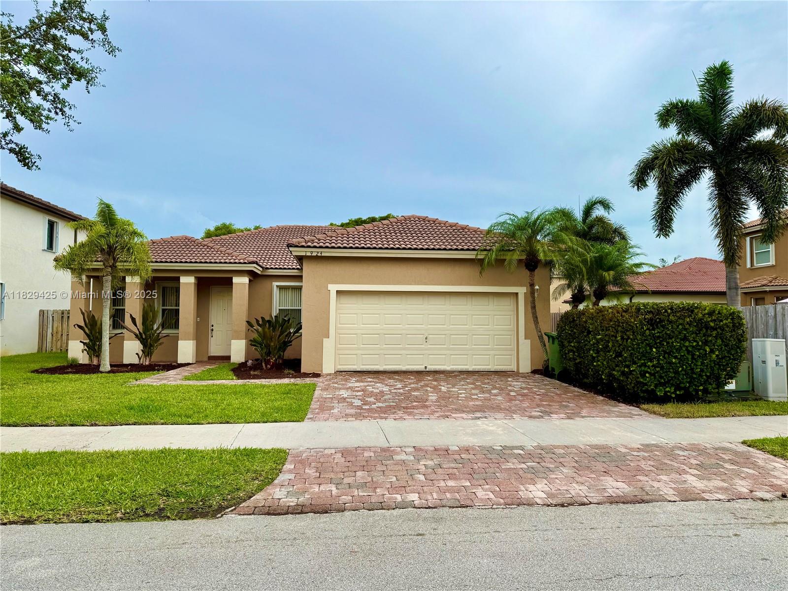 Welcome to this beautiful, maintained 3/2 home with a 2-car garage, located in the exclusive gated community of The Shores. This charming residence features a spacious open floor plan with tile flooring throughout, perfect for easy maintenance. Enjoy peace of mind with accordion shutters on all windows and doors.  New Privacy fence will be installed. The rent includes direct TV, cable, high-speed internet, and alarm monitoring. You will enjoy 24-hr  gated security with roving patrols, Access to the community tennis center, and well-maintained surroundings ideal for relaxed, upscale living. Application requirement: Please submit the following: Recent pay stubs, credit report with score, photo ID, rental application, and contract to lease.