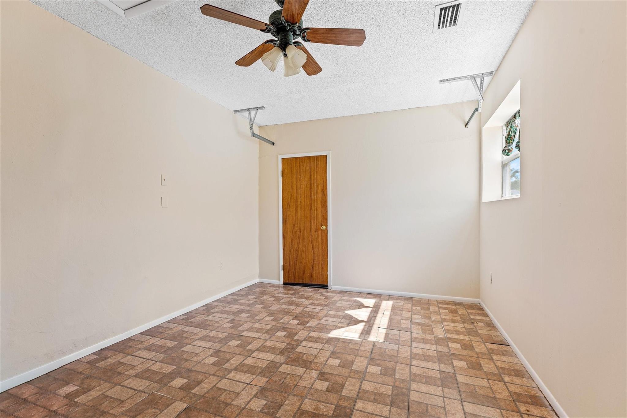 Converted garage with garage storage behind door