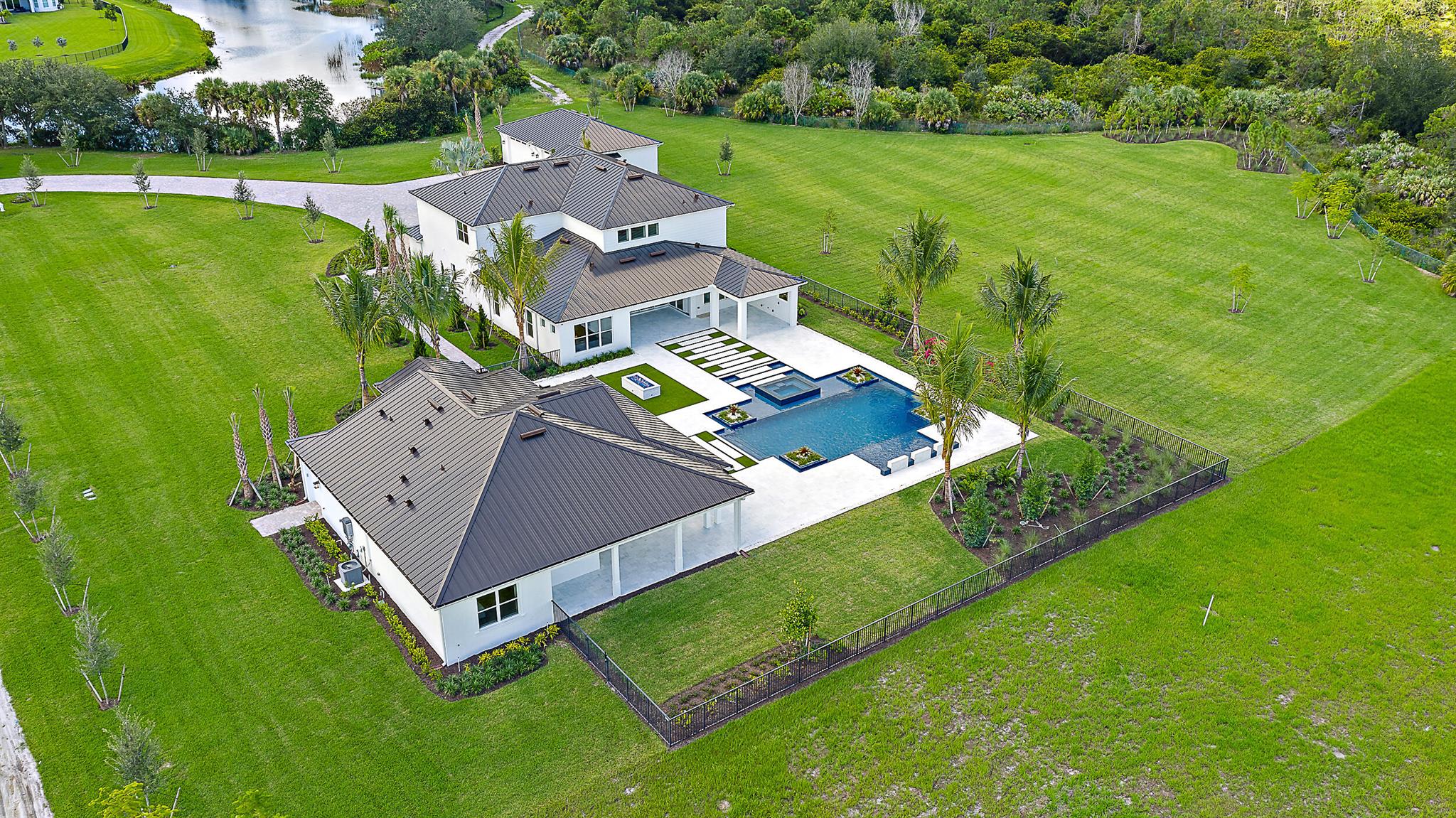 Bridgewater's crown jewel - a rare 4.61-acre estate offering unmatched privacy, luxury, and lifestyle in the heart of Jupiter, east of I-95.Set on one of the largest and most private homesites in the nearly sold-out Bridgewater community, this exceptional property features brand-new construction, a separate guest house, detached garage, and a resort-style saltwater pool -- all surrounded by lush landscape and endless potential. With only one neighboring home and direct adjacency to Jonathan Dickinson State Park, this estate delivers the ultimate blend of elegance, convenience, and natural tranquility. Design your dream outdoor oasis with ample space for a private golf hole, pickleball court, or tennis court. The main residence is complemented by a detached garage and a separate guest home (approximately 1,800 sq ft) offering a bedroom, full kitchen, laundry room, and an expansive wraparound covered lanai &#x14; perfect for hosting guests in comfort and style.

Bridgewater is one of Jupiter's most prestigious gated communities, celebrated for its contemporary estate homes, oversized lots, and A-rated schools. Located just minutes from championship golf courses, world-class marinas, stunning beaches, and fine dining, this property represents a rare chance to enjoy the very best of the Jupiter lifestyle &#x14; with the space and serenity that are nearly impossible to find east of I-95.