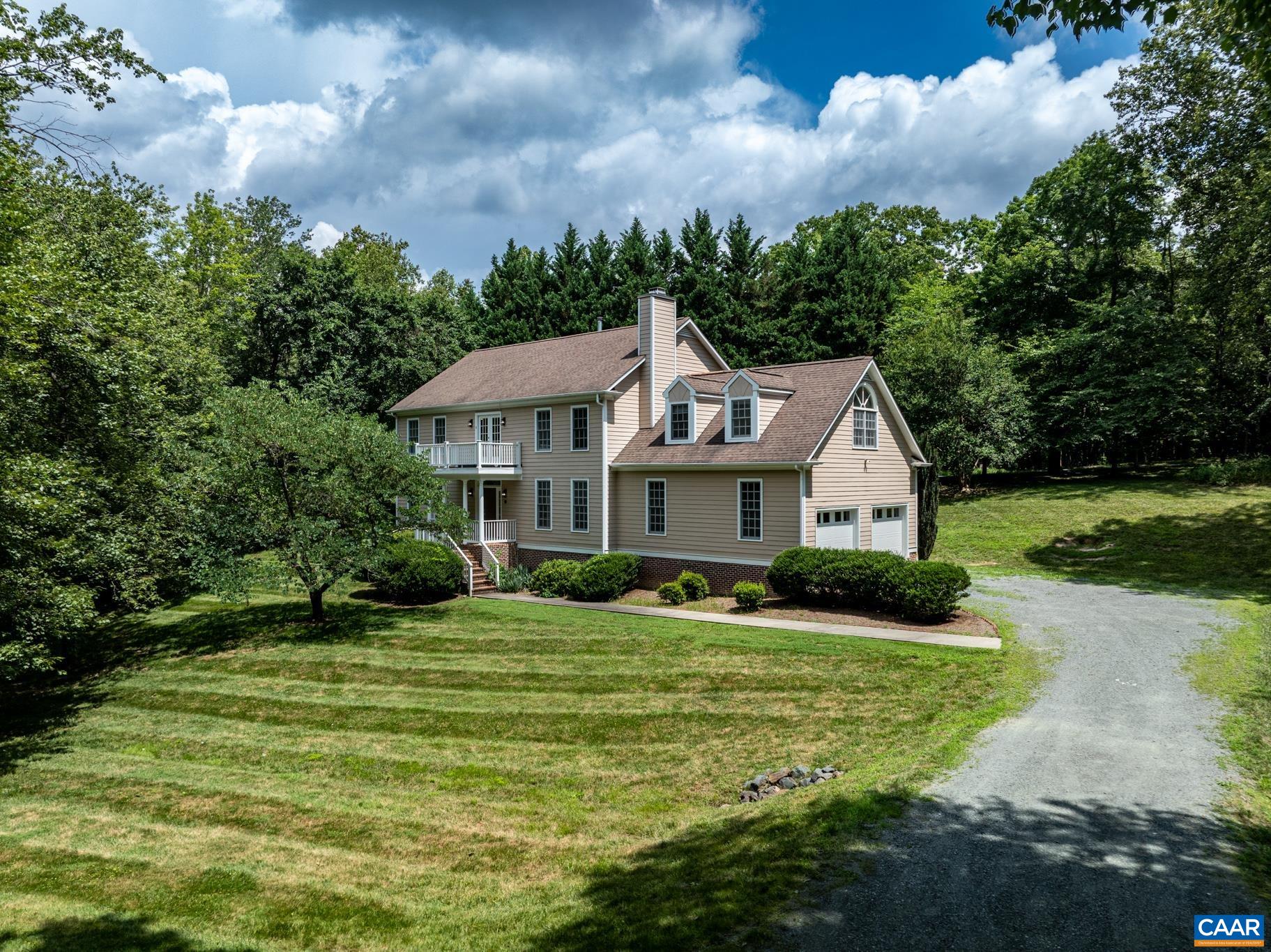 Beautifully Renovated & Perfectly Private!  Enjoy the best of both worlds—close to town yet nestled on 2.5 private acres. This stunning home has been thoughtfully renovated and is move-in ready. The spacious kitchen with double ovens is ideal for entertaining, while the screened-in porch is perfect for peaceful mornings with coffee or relaxing evenings with a cold drink.  The primary suite offers a true retreat, complete with a cozy sitting room, fireplace, and private balcony. A large bonus room adds flexibility for a home office, gym, guest suite, or playroom. You'll also love the oversized attached garage—great for storage or projects.  All of this with the added comfort and convenience of having a whole house generator.    Vacant and easy to show—this is one you don’t want to miss!