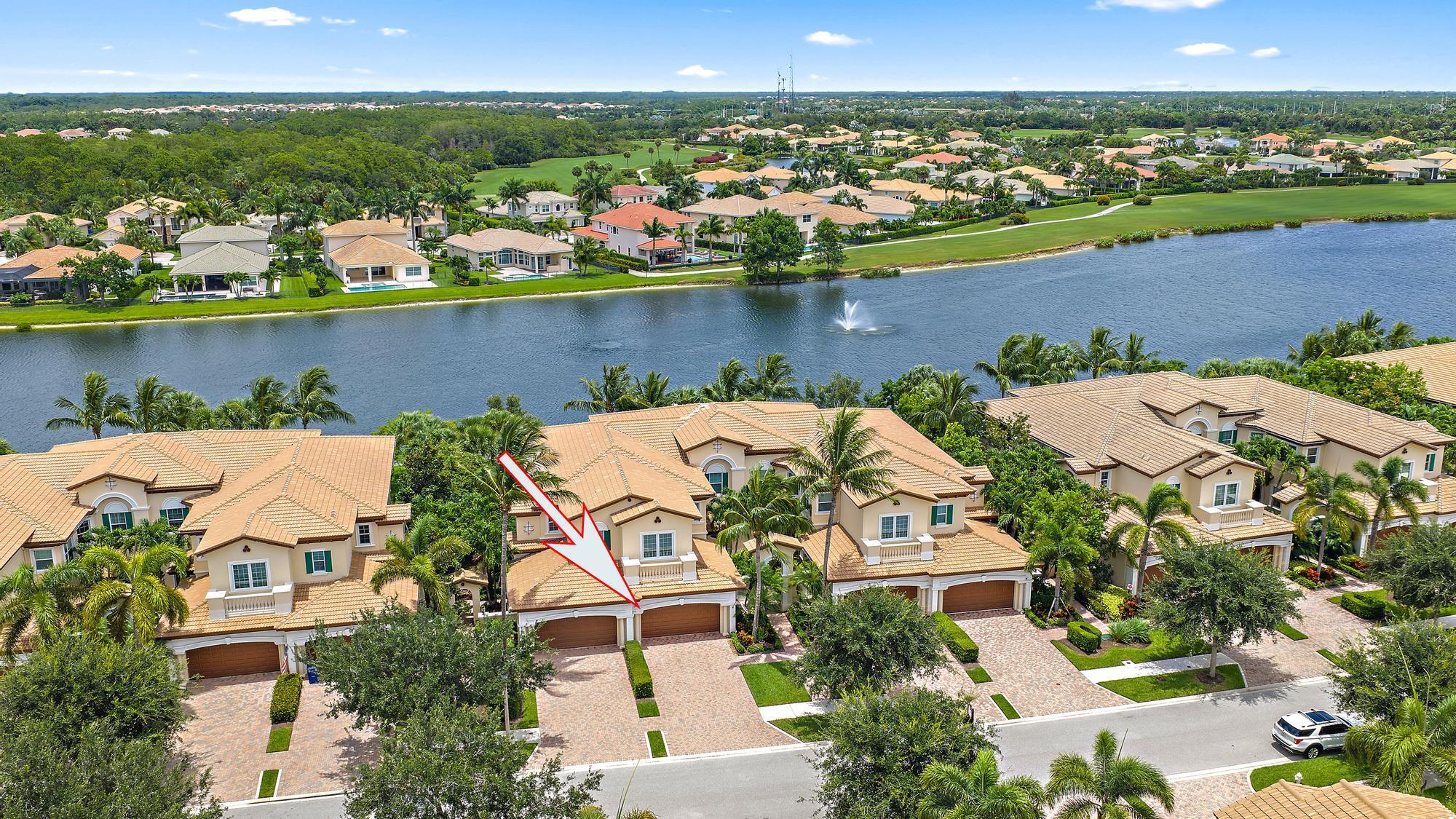 Gorgeous lake views could be yours from this exceptional 2 bedroom, 2 bath + flex room/office (offering custom built outs), 2 car garage one-story carriage home in the resort-style guard gated community of ''Jupiter Country Club''. This great open-concept home exudes high ceilings, is elegantly inviting and provides all of the essentials for easy Florida living. Live comfortably in this energy-efficient home with a tankless water heater, CBS construction & impact glass windows throughout. Countless interior designer upgrades include tray ceilings, crown molding, plantation shutters, porcelain tile flooring, and stylish light fixtures & ceiling fans. Enjoy the sunsets & wide lake views from the private screen-enclosed covered patio. The kitchen boasts white wood cabinetry, granite countertops, a stone tile backsplash, stainless steel appliances, and a large center island with contemporary pendant lighting. The primary suite is spacious with a tray ceiling, crown molding, a huge walk-in closet, and offers access to the patio. The primary bath is spa-like with dual vanities, a makeup sitting area, a large soaking tub, and walk-in shower with a frameless glass enclosure. The spacious second bedroom can comfortably accommodate a king bed for your guests. The den/flex room can be utilized as a convertible 3rd bedroom, TV room, office or exercise room. More features include: All custom closets &amp; organizers, high end Epoxy finish garage floors, garage built ins for ample storage, all new fans &amp; fixtures.  *Club/social membership is required. Please inquire about current availability for the of membership.* Jupiter Country Club is a luxury gated community conveniently located within close proximity of I-95 and the FL Turnpike, beaches, shopping, restaurants, parks &amp; nature preserves. Club amenities include a Greg Norman designed golf course, 2 resort-style pools, the newly remodeled Sway restaurant, a state-of-the-art fitness center plus yoga/mat pilates/barre classes, tennis, bocce ball, pickle ball &amp; basketball. Come &amp; join this amazing community in Jupiter!