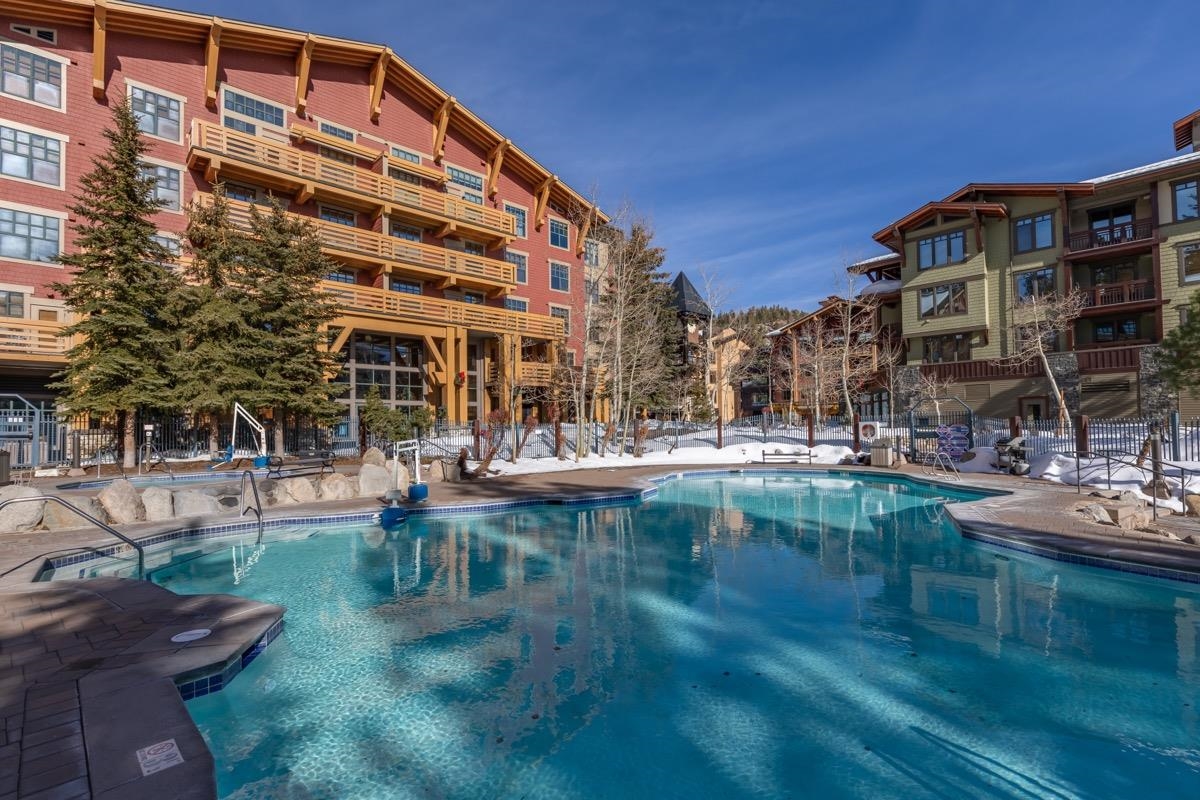 Modern Mountain Rеtreаt – Unіt ⵌ1413, Grand Ѕiеrra Lodge at The Vіllagе at Mammoth.  Welcome to Unit #1413 at the Grand Sierra Lodge — a beautifully renovated three-bedroom condo in the heart of The Village at Mammoth. This spacious, Mountain Modern retreat blends luxury, comfort, and style, making it not only a perfect year-round getaway but also a great investment opportunity. The condo features new wood flooring, updated bathrooms with sleek black-and-white finishes, and contemporary decor throughout. Enjoy a fully equipped kitchen, a cozy living area with a fireplace, and three well-appointed bedrooms — all offering scenic views of the pool and tranquil, park-like surroundings. Convenience is key: park your car in the heated underground garage and step out to restaurants, shops, and the Village Gondola — all just outside your door. Grand Sierra Lodge amenities include a heated pool, hot tubs, a fitness center, and more. Whether you're carving the slopes in winter or exploring Mammoth’s trails in summer, Unit #1413 offers a stylish, turnkey home base — and a smart addition to your real estate portfolio.