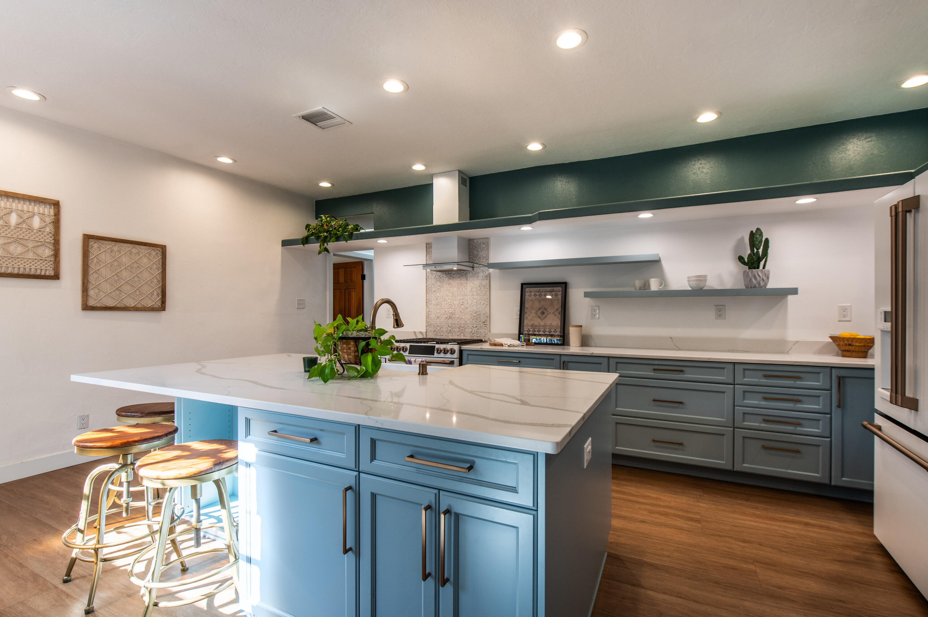 Formerly the iconic and beloved Cinnamon Morning Bed and Breakfast, this special North Valley home offers so many possibilities! Property includes a charming main home w/ 4 bdrms (3 w/en-suite baths) PLUS a separate 3 bdrm 2 bath home! Could be a great family compound! Main home includes beautifully updated kitchen w/dbl oven, gas stove, under counter micro, island with bk bar. Gorgeous! Generous primary with updated bath w/dbl sinks & walk-in shower. Updated hall bath w/vessel tub. Recent HVAC, tankless H20 heater and new roof 2024. Covered patio w/outdoor kitchen, seating and fireplace leads to 2nd home which has Primary w/bath & frplce, 2bdrms,full bath,  living rm w/frplc, dining area & kitchen.  Short distance to acequias, The Bosque, the Co-op.  North Valley living at it's best!