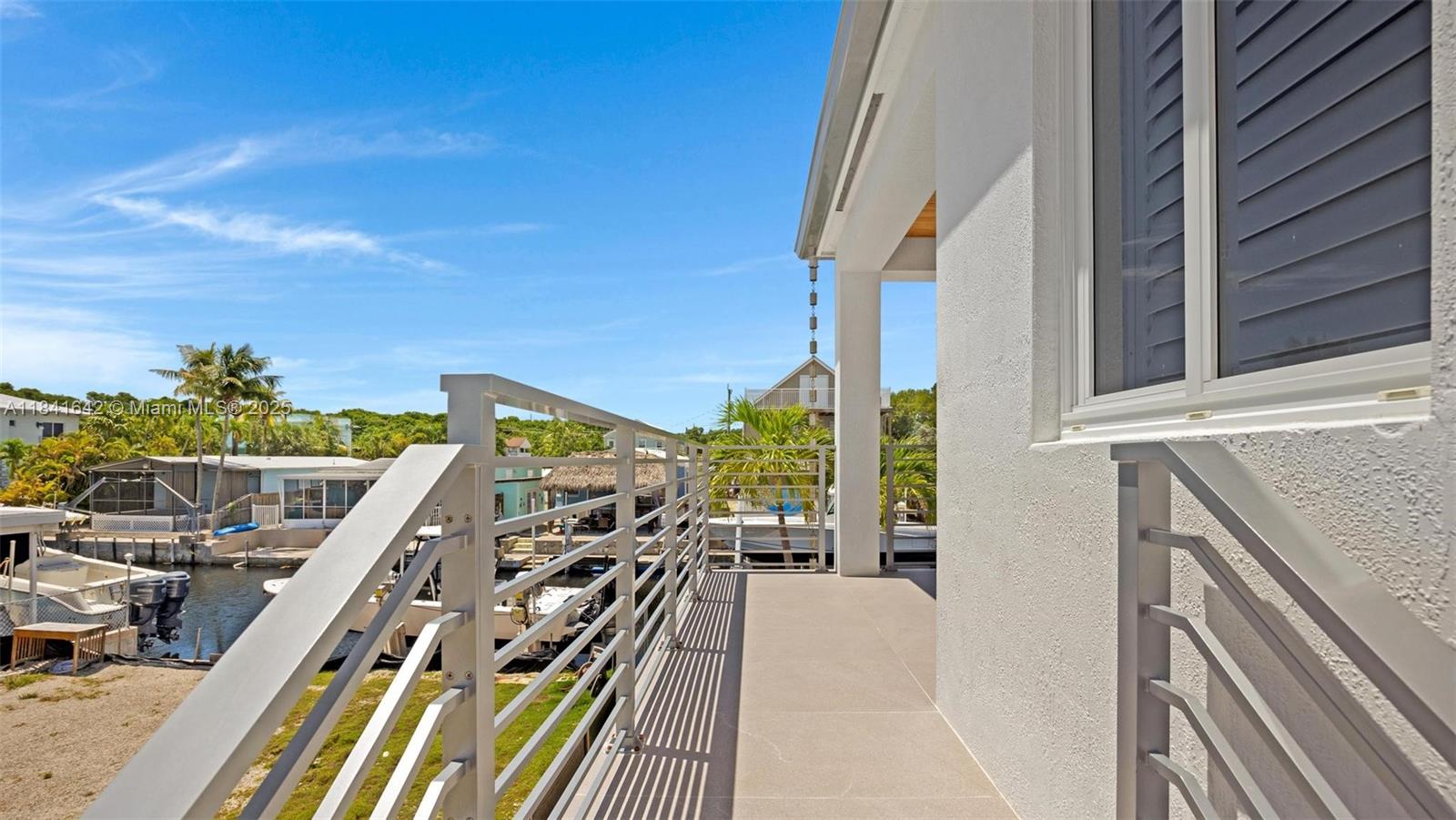 Elegant master bedroom retreat at 410 Bowie Ln - Home in Key Largo