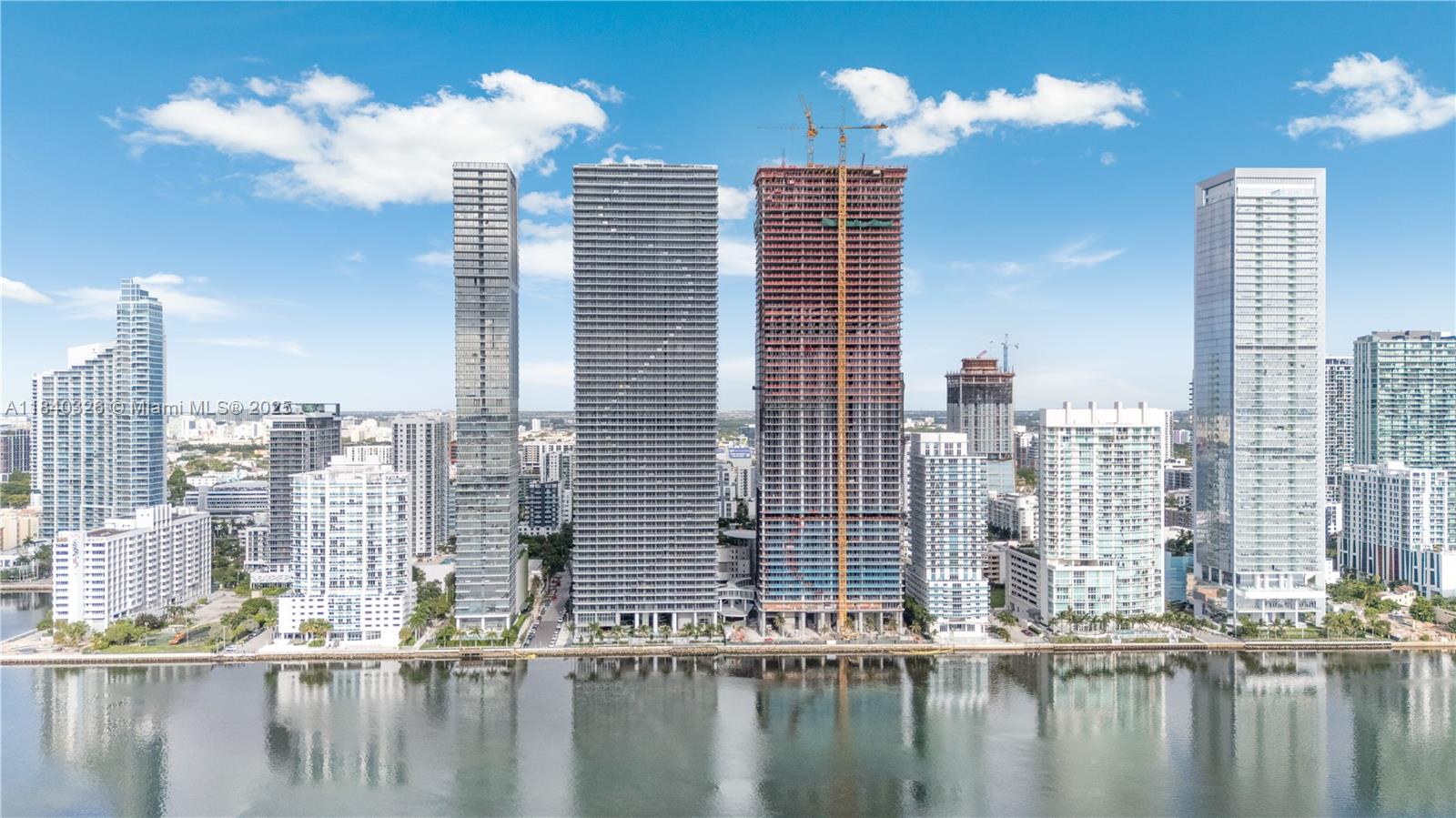 Brand New 2025! Luxurious 3-bedroom, 3.5- bathroom + Den. This sophisticated unit spans 1,643 sqft of living area, and a stunning 242 sqft terrace with direct water views. Unit features $150,000+ in upgrades including Nera Roble Oak porcelain tile floors throughout, extending to the balcony, walls painted in a soft tone. The upgraded kitchen boasts top-of-the-line appliances, Neural matte engineered stone countertops in a warm cream tone, and backsplash. All bathrooms have glass shower enclosures. 2 assigned parking spaces. The building offers over an acre of luxury amenities, including a top-tier gym, wellness spa, kids' playground, wine lounge, state-of-the-art library, party room, lap pool, tennis and paddleball courts, mini golf, and more providing an unparalleled living experience.