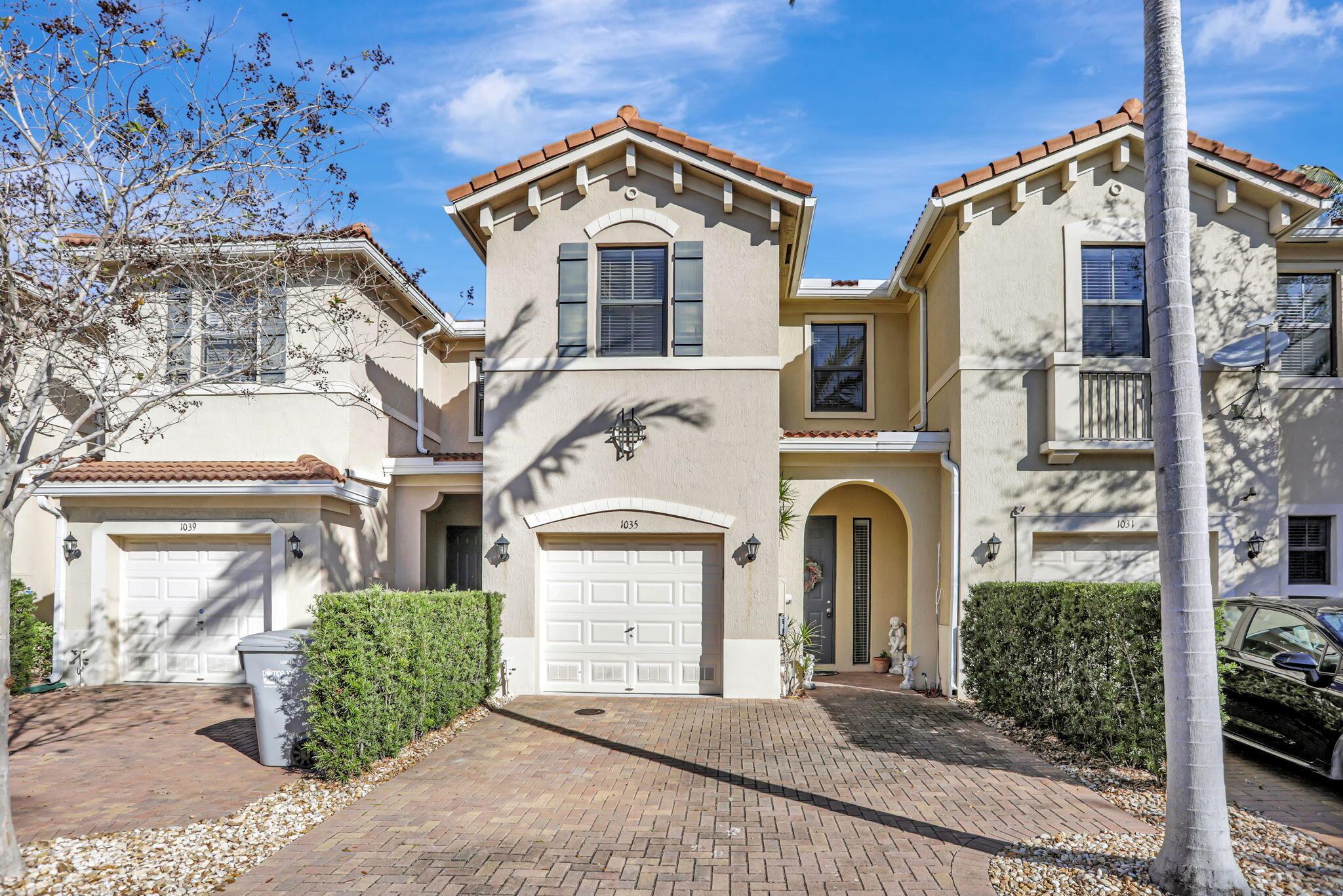 Beautifully updated 3-bed, 2.5-bath townhome in the gated community of Madison Place, Pompano Beach! Better than new! Built in 2017 with largest floor plan in the community, this home features hurricane-impact windows, 9'6'' ceilings, and serene lake views. The modern kitchen offers white cabinetry, beautiful granite counters, an island, and stainless steel appliances, with a patio off the dining area. The primary suite has a walk-in closet, plus an upstairs washer/dryer. Enjoy a 1-car garage, 2-car driveway, and low $158 HOA. Lake front community pool, gazebo, and playground. Prime location near major roads, shopping, dining, and nightlife with easy access to Palm Beach, Fort Lauderdale, and Miami. Pet-friendly!
