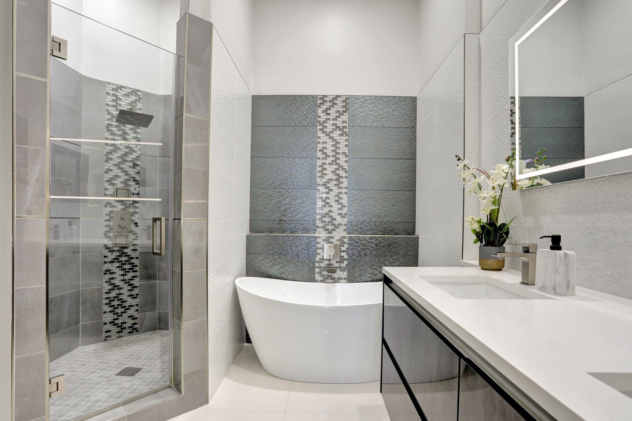 Impeccably maintained and modernly updated, this 3BR/2BA townhouse in guard-gated, pet-friendly Boca Pointe features a completely renovated kitchen and bathrooms, porcelain tile floors throughout (no carpet), 1-car garage plus driveway and guest parking nearby, and newer tile roof (2020). Offered partially furnished. Spacious enclosed balcony perfect for added living space. HOA includes landscaping, roof, building insurance, cable, security, and access to community satellite pool. Rentals permitted with a 4-month minimum lease. Signed seasonal lease is in place for 12/15/25-4/15/26 with rent fully paid and transferrable to buyer. Centrally located in Boca Raton, zoned for A-rated schools, and close to shopping, dining, and beaches. Optional Boca Pointe Country Club membership available.