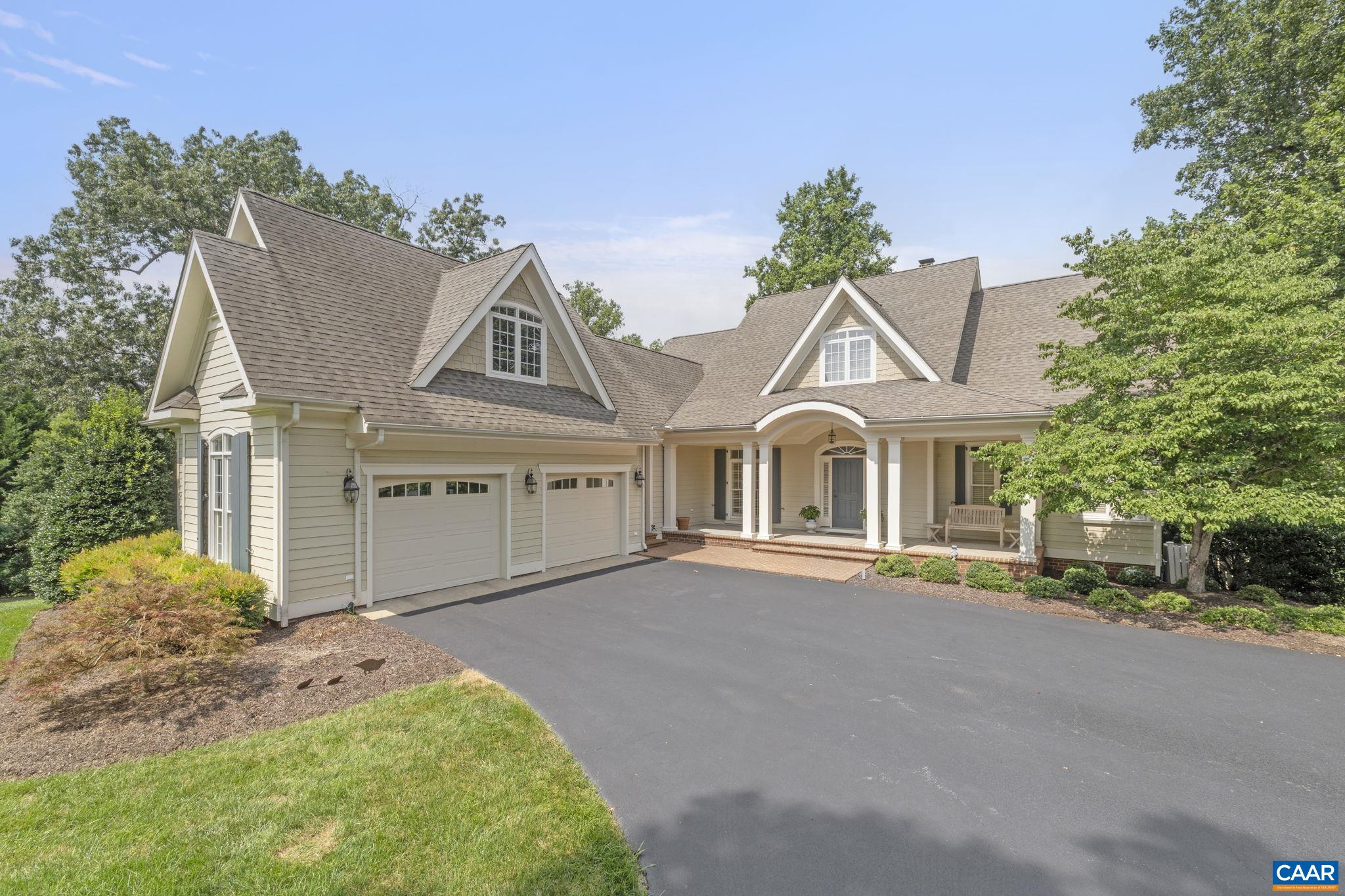 Custom home with Blue Ridge Mountain views on just over an acre in Foxchase. This transitional design features a grand living room with an 18.5-foot cathedral ceiling, built-in bookshelves, a brick fireplace with a raised hearth, hardwood flooring, and a wall of windows showcasing the view. The home has a very inviting open plan, including 5 bedrooms, 3.5 baths, a study, a den, a terrace-level family room, and more.  The home is flooded with natural light. The terrace level has recently been finished, except for the flooring. There is also an unfinished bonus room above the garage that could serve as a home office or gym. The property is situated on a cul-de-sac that backs up to Foxchase Open Space and Lickinghole Creek, as well as the Lickinghole Creek Basin. There is easy access to Albemarle County schools, shopping, Crozet, Charlottesville, and the University of Virginia. Foxchase offers wonderful amenities, including tennis, a community pool, and a clubhouse. This house has been meticulously maintained by the original owner and will not disappoint.