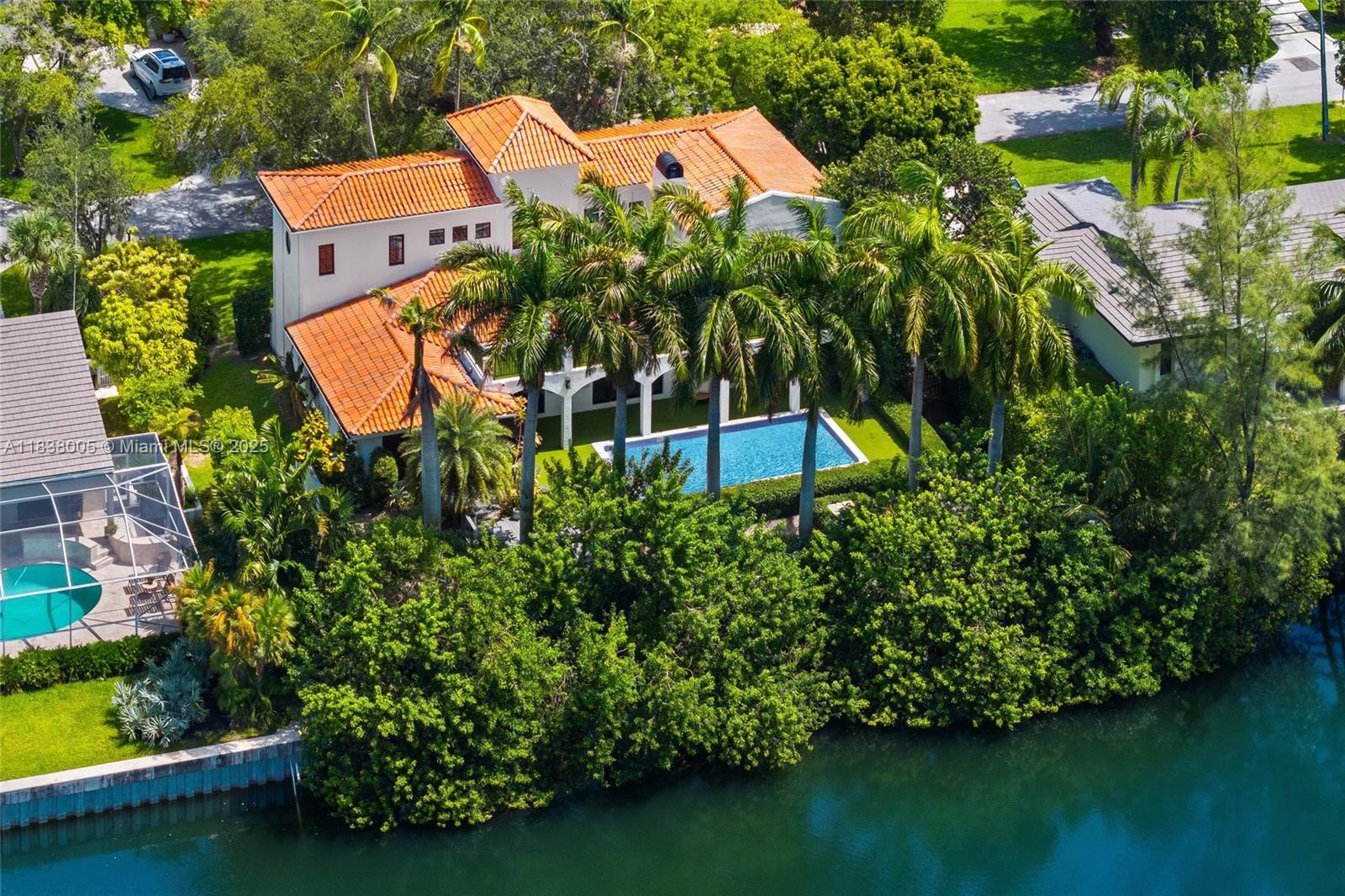 Nestled within the highly sought-after, guard-gated community of Gables by the Sea, this beautifully renovated two-story residence seamlessly blends Mediterranean charm with Modern sophistication. Step into an impressive foyer with soaring ceilings that lead you into elegant living spaces, all offering stunning views of the lush outdoor spaces. Enjoy your large primary suite upstairs that features a private terrace, making it the perfect spot to unwind while taking in serene sunset views overlooking the water. (No Open Bay Access) The gourmet kitchen is equipped with top of the line appliances, quartzite countertops, a gas stove, and a stylish breakfast nook. Outside, enjoy professionally landscaped grounds with a lounge area and a pool. Your elegant home in Gables by the Sea awaits!