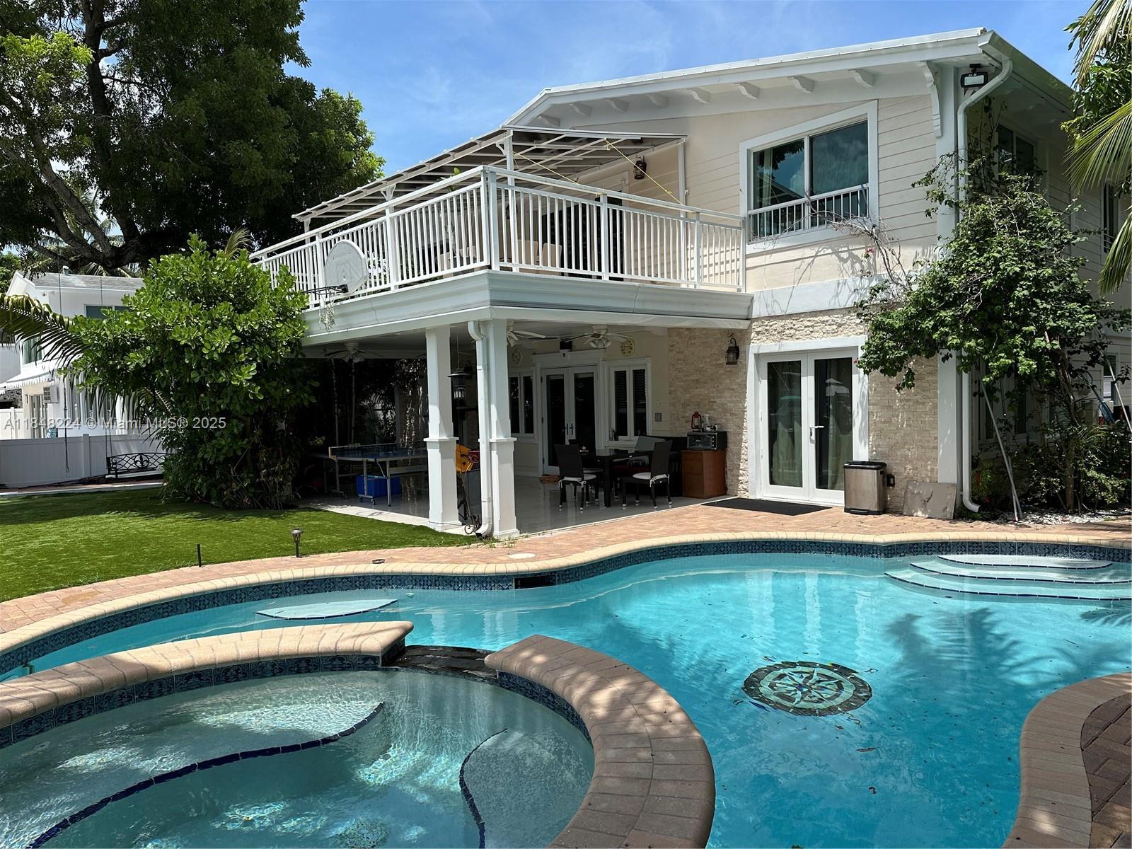 Key West Style, Amazing Intercoastal peaceful waterfront home, 2 floor private House, with 95 feet long deck. Renovated with brand new kitchens. Second story w/ Rooftop Terrace. Also 2 kitchen and 2 living room, so house can be used as two separate homes, with heated Pool and Spa, with Gym. no fixed bridges & has spectacular wide view of the North Fork of the New River. 95 feet of linear water frontage & With 6 feet depth. Deep enough for Sailboat. Quick ride to the ocean.