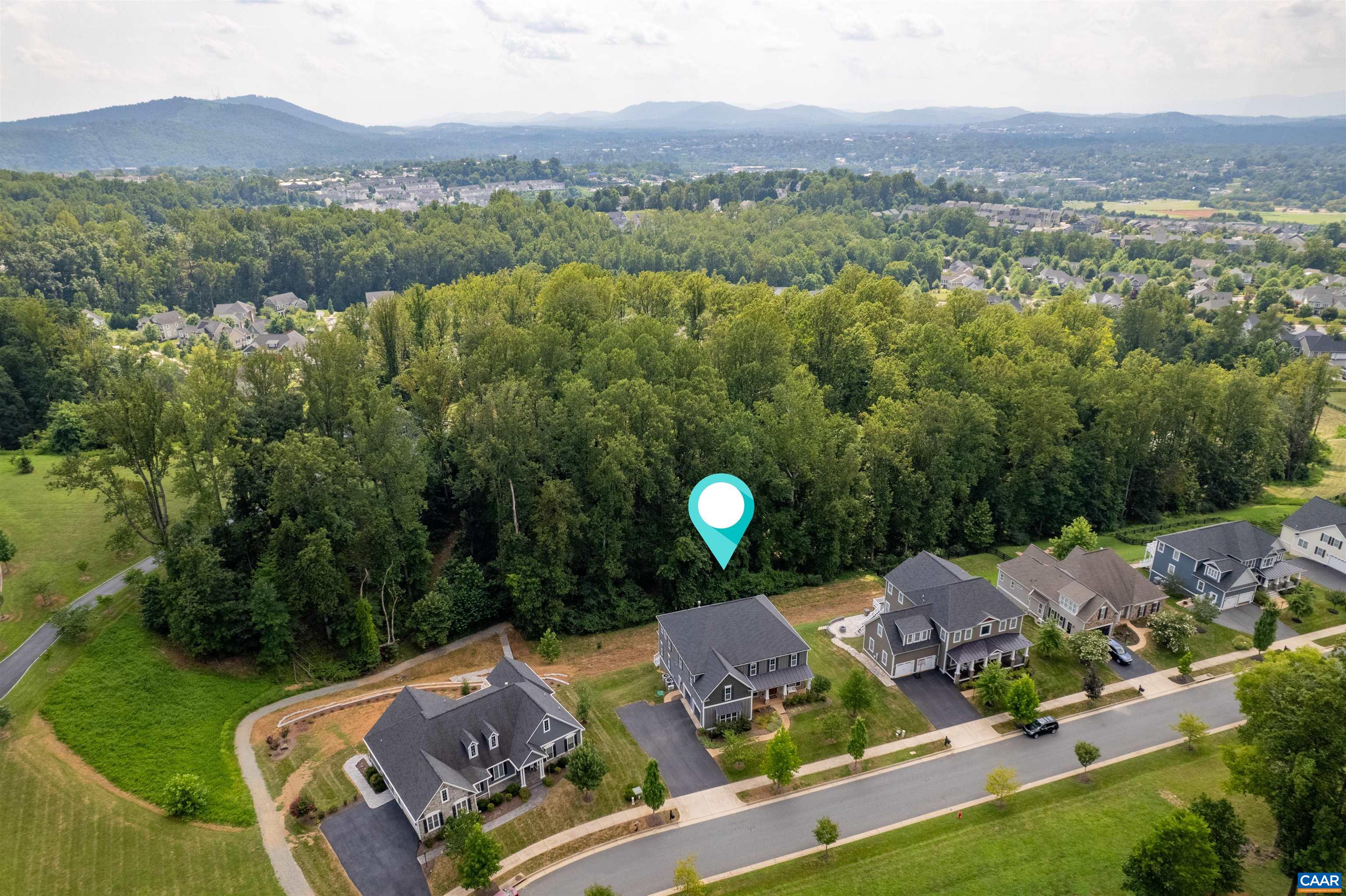 Live the elevated Charlottesville lifestyle in this Craig Builders custom home offering panoramic mountain views, luxurious finishes, and flexible living spaces for today’s modern family. The main level features an open-concept kitchen with oversized island, coffered ceilings, and gas fireplace, perfect for gatherings and cozy evenings in. A full secondary primary suite and home office make this floor ideal for multigenerational living or remote work. Upstairs, retreat to the spa-inspired owner’s suite with dual vanities, soaking tub, and tiled shower, plus three ensuite bedrooms for family and guests. The walk-out basement offers a large recreation room, full bath, and unfinished rooms ready for a gym, media, or wine cellar. Step outside to a private 0.46-acre lot with patio and deck, ideal for sunset views. Minutes to Pantops, Darden Towe Park, and downtown Charlottesville, this 2016-built home blends craftsmanship, comfort, and convenience. Seller offering $20,000 credit toward closing or interest rate buy-down with an acceptable offer. Open this Sunday 9th, 12:30-2pm, or schedule your private tour today!