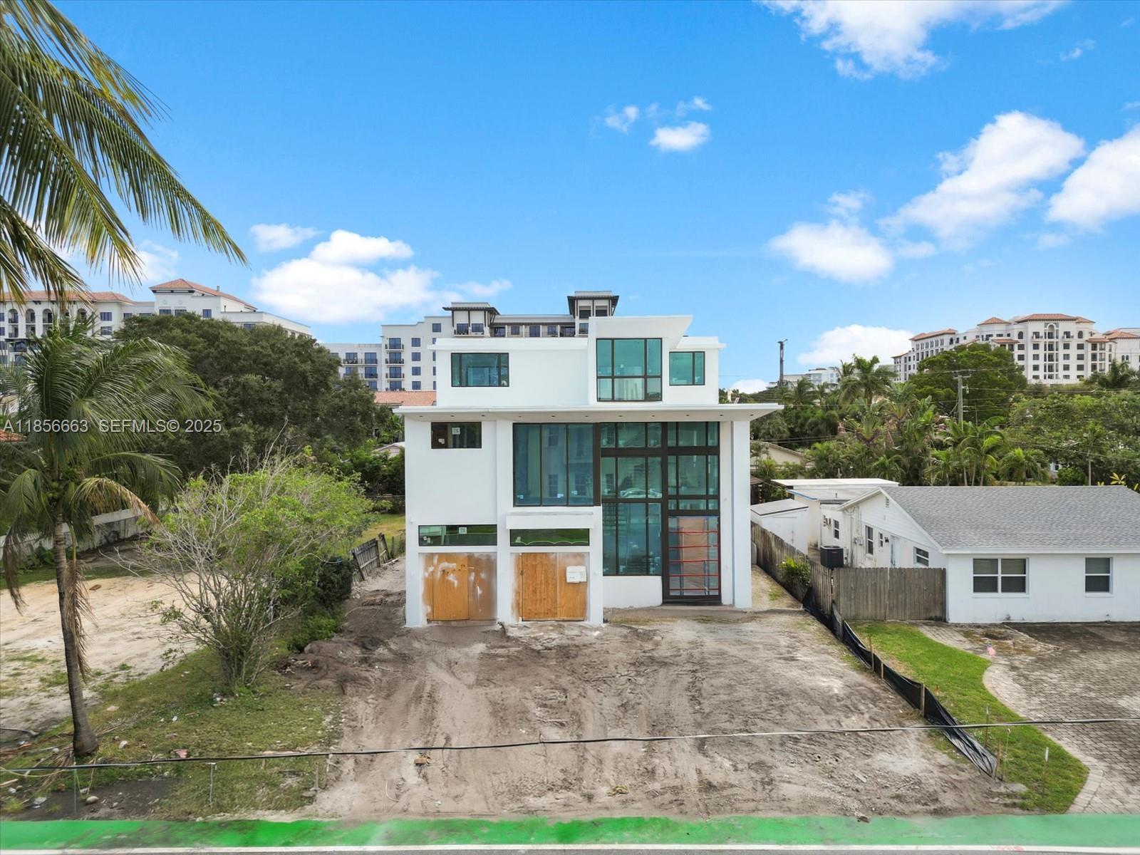 This exceptional, brand-new three-story estate by Yacov Development Group sets the standard for modern luxury in Boca Villas. Thoughtfully designed, the home offers exquisite elegance at every turn. The state-of-the-art chef’s kitchen is a culinary masterpiece, while five lavish bedrooms, six full bathrooms, and one half bath provide impeccable comfort. The primary suite features a private balcony and dual walk-in closets. An upstairs loft offers a serene space for relaxation. The third floor boasts an impressive clubroom with a full bar and expansive terrace—perfect for lavish entertaining. A luxurious pool and outdoor patio provide the ultimate relaxation. Ideally located in exclusive East Boca Raton, steps from The Boca Raton, Mizner Park, & the ocean. Q1 2026 Completion.