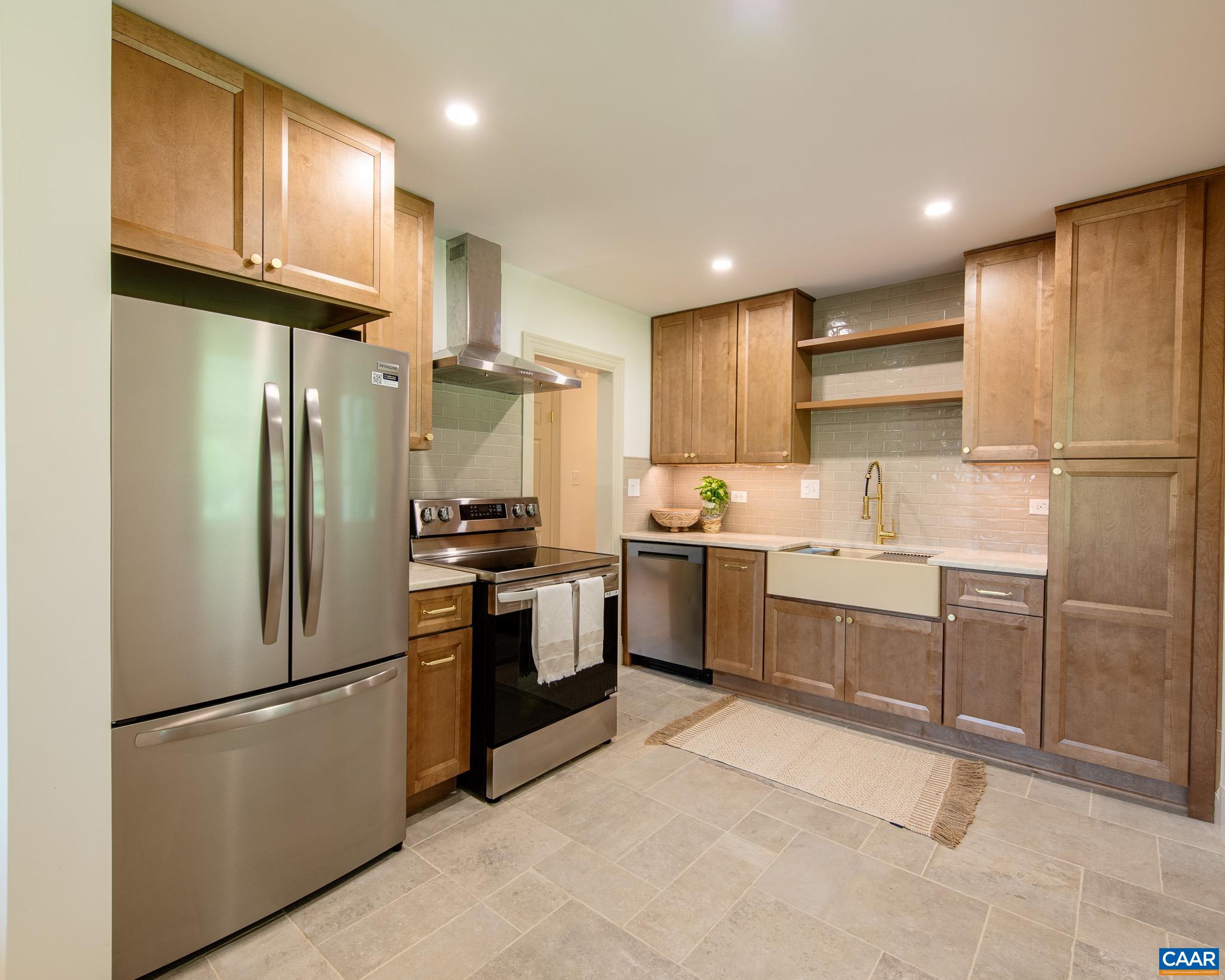 Beautifully Renovated Home in Prime Charlottesville Location! Welcome to this stunning brick ranch in the highly sought-after Rose Hill neighborhood just minutes from downtown Charlottesville, UVA, and some of the area’s best entertainment. Every inch of this home has been thoughtfully renovated, blending modern style with timeless charm. Inside, you’ll find refinished original hardwood floors, fresh paint, and stylish new fixtures throughout. The light-filled kitchen features Taj Mahal quartzite counters, a quartz farmhouse sink, and new cabinetry—perfect for both everyday living and entertaining. The hall bath has been completely refreshed with new tile floors and a floor-to-ceiling tiled bath/shower combo, while the expanded primary bath now includes a gorgeous walk-in shower. Enjoy cozy evenings on the newly redone screened porch with elegant Virginia bluestone, or spread out in the finished basement with hardwood floors—ideal for a home office, media room, or guest space. Original details, like charming pocket doors, have been preserved, giving the home a character that blends seamlessly with its fresh, modern upgrades. This move-in ready gem offers the perfect combination of location, style, and functionality! Owner/agent.