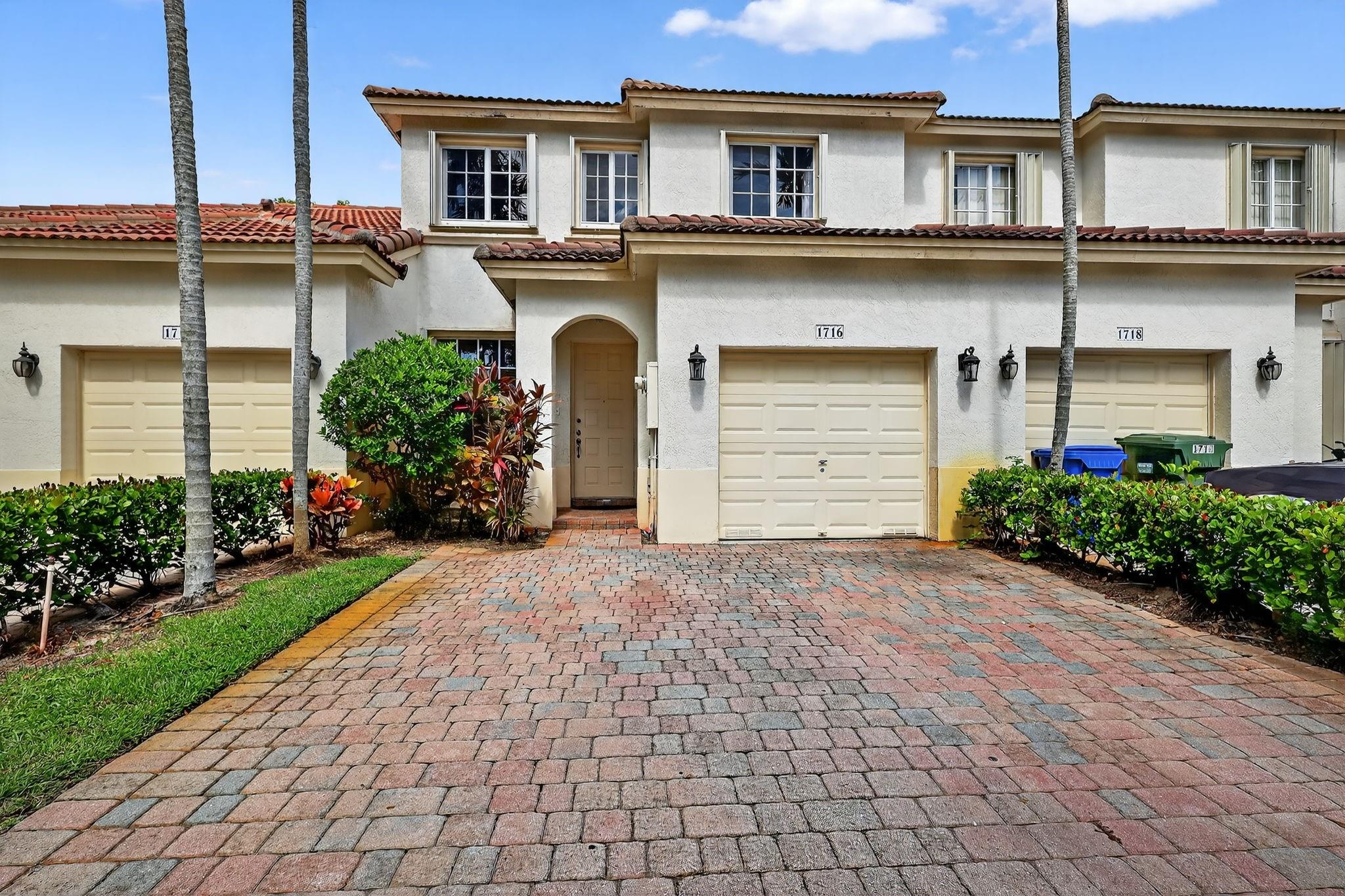 PRICED TO SELL + Up to $5000 credit towards closing cost with agreeable contracted terms. Gated community w/pool, kids pool, clubhouse, gym, tennis. 3-bedroom, 3 full bath townhouse PLUS LOFT is turnkey. One full bedroom & bathroom on first floor. Loft has cabinets/desk that can be a mini office space or study area. Watch TV, work, use as a play area - several possibilities. Home is located on a pond w/ privacy hedges across the way. Cul de sac street. No carpet to vaccuum. Tile & laminate throughout. Smart stainless steel appliances. Extra cabinets in kitchen wall nook. Closet racks throughout. Hurricane shutters. Approx ages: water heater 2 yrs, washer dryer 5yrs, appliances 3 yrs. HOA includes: cable, alarm, internet, manned guard gate, amentities. Cherish every moment in this home.