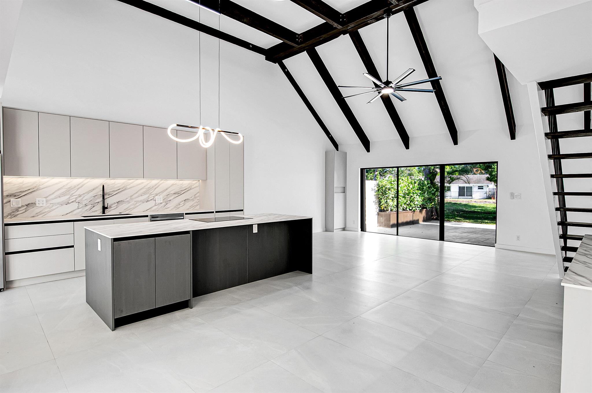 Step inside this beautifully upgraded 3-bedroom, 2-bath townhome with over 2,000 square feet under air and so much to love. Enjoy a first-floor master suite for comfort and ease, and soaring wood-beam ceilings that add charm and a spacious feel. The kitchen is brand new and ready for your favorite meals, and a new roof adds long-term peace of mind. Light fills every room, and the private patio is a perfect retreat with no rear neighbors. 1-car garage adds extra convenience. This is one of the best homes in the entire community. Zoned for a brand-new A-rated K-8 school. You can walk to your house of worship, and within minutes, enjoy Mizner Park, the beach, Town Center Mall, and top restaurants. The community features two heated pools and two tennis courts.