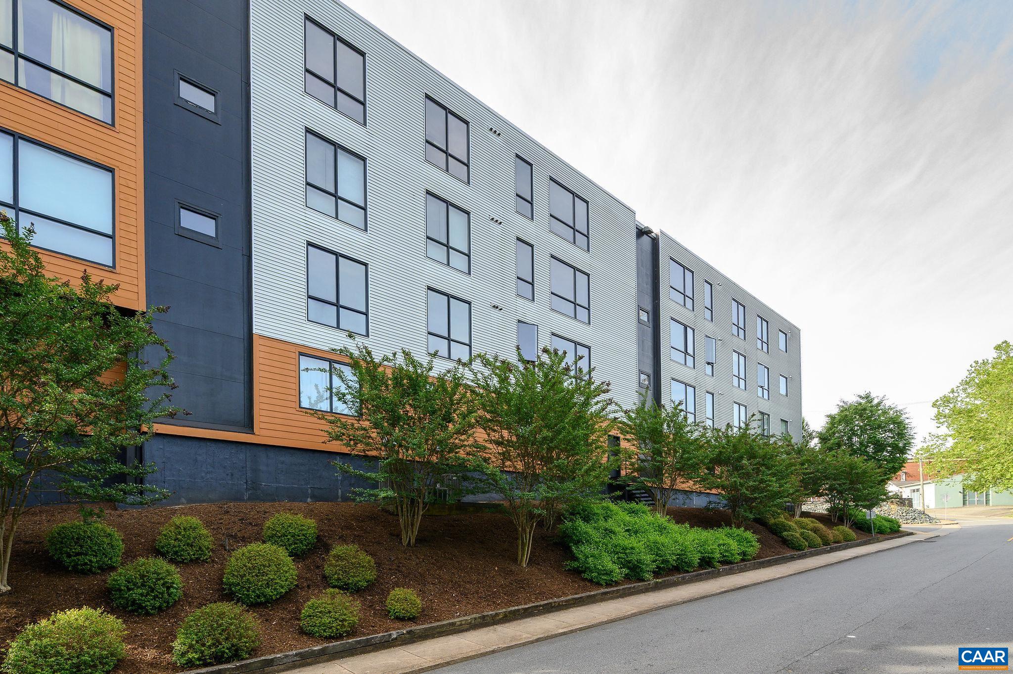 City life at its best. 97 Walk Score, 85 Bike Score. Beautiful Contemporary Condo in Boutique Elevator Building just one block from the shops and restaurants of West Main, this stylish condo offers the perfect blend of modern living and convenience. The light-filled interior features oversized operable windows, high ceilings, fresh paint, and a mix of concrete, tile, and carpet flooring. Both bedrooms include en-suite baths, complemented by an additional office space. Amenities include dedicated off-street parking, ample guest parking, and a private storage room. Walkable to Downtown and UVA, this home combines comfort, function, and an unbeatable location.