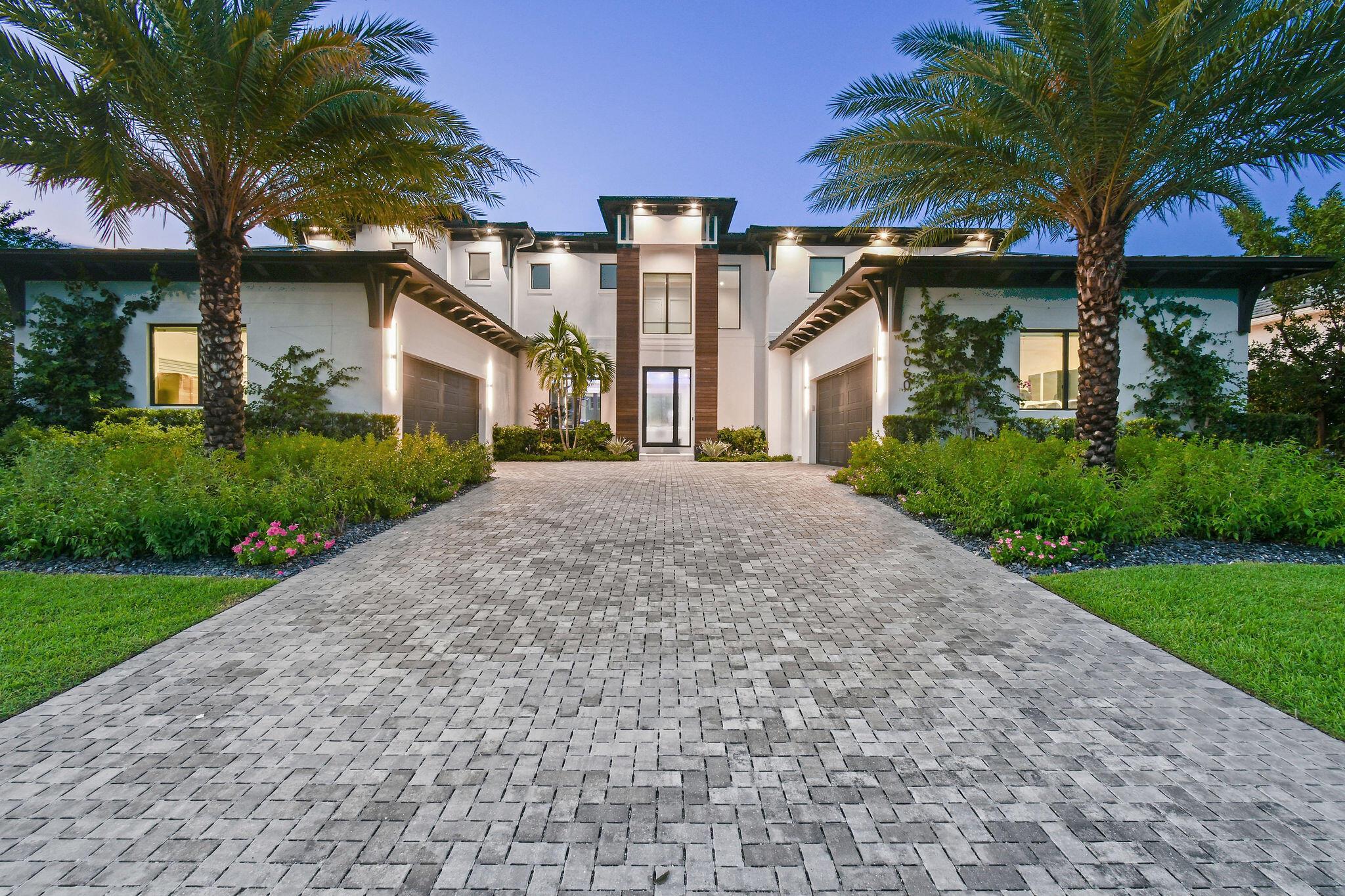 Experience the ultimate in coastal living with this custom-built residence, perfectly situated on a deep-water canal with 100 feet of waterfront and direct ocean access. Located in the prestigious Palm Beach Isles community on Singer Island, this home is surrounded by exceptional properties and just moments from pristine beaches, fine dining, and luxury spas. Designed for boaters and entertainers alike, 1060 Fairview Lane features a brand-new dock, new 40,000 lb boat lift, an ultra-sleek Euro-edge pool and spa, and an expansive covered patio with a full summer kitchen. The generous floor plan spans over 6,500 square feet of living space and offers 5 bedrooms, including upper and lower primary suite options, plus 7 full baths, a 6th bedroom/club room, and a private study. Whole house water filtration system with reverse osmosis. Dual temperature-controlled garages provide lift-ready volume and abundant storage for boating gear. Smart home automation controls security, sound, pool systems, and more, allowing you to enjoy effortless luxury. A rare opportunity to own a waterfront retreat blending modern sophistication with exceptional boating access in one of Palm Beach County's most desirable neighborhoods.
