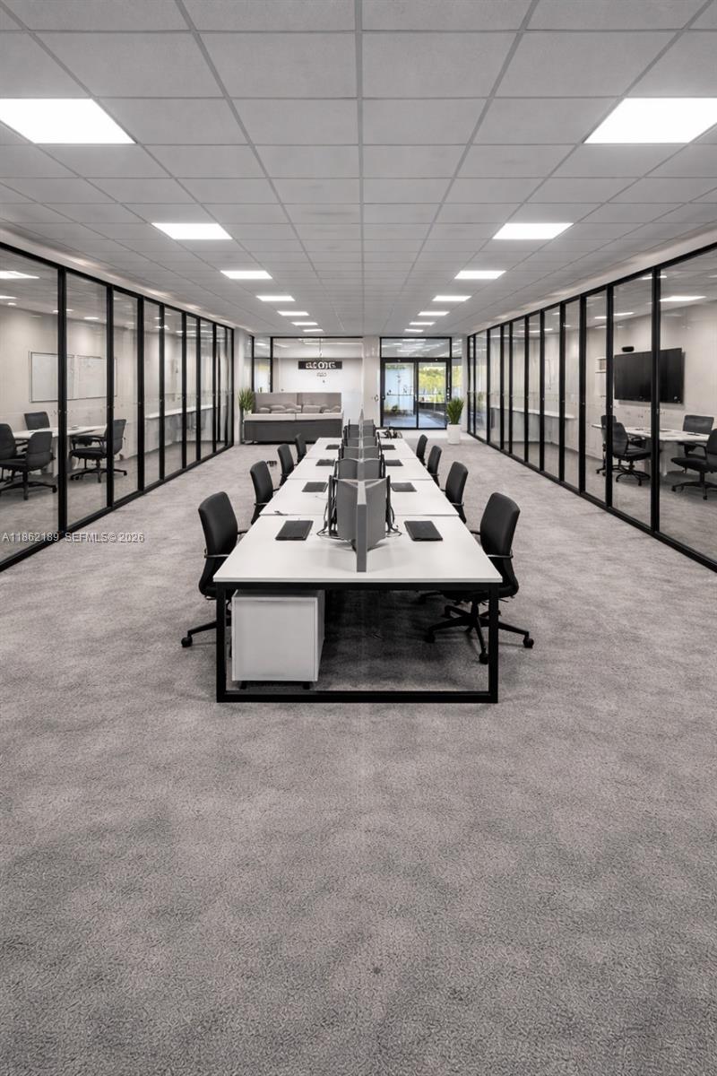 Excellent opportunity to lease a ±2,750 SF brand-new office space, delivered vacant in shell condition, allowing tenant to customize and build out to their needs. The open layout with emergency exit door, offers flexibility for corporate offices, professional services, coworking, or medical/wellness use (subject to approvals). Features ample and unrestricted parking and is located in a prime commercial area surrounded by businesses, hotels, professional offices, and restaurants. Less than 1 mile from the Florida Turnpike and approximately 3 miles from the Palmetto Expressway. Electricity, water, and association fees included.