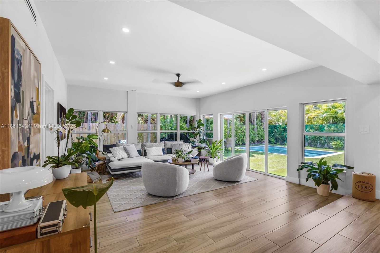 Charming and beautifully updated 5BD/4.5BA home in the heart of Key Biscayne. With 2,666 SF under A/C, this residence offers a spacious split floor plan filled with natural light, inviting living and dining areas, and multiple social spaces that flow seamlessly to a private backyard. Recent upgrades include a brand-new roof, pool, kitchen with modern appliances, flooring, bathrooms, A/C units and ducts, fencing, turf, lighting, doors, and more. Perfect for families, the home offers two primary suites, generous closets, and a welcoming layout. Enjoy a private outdoor oasis with lush landscaping, covered terrace, and pool - ideal for entertaining or relaxing. Just steps from the park and close to the beach, shops, and restaurants, this property is a true island gem.