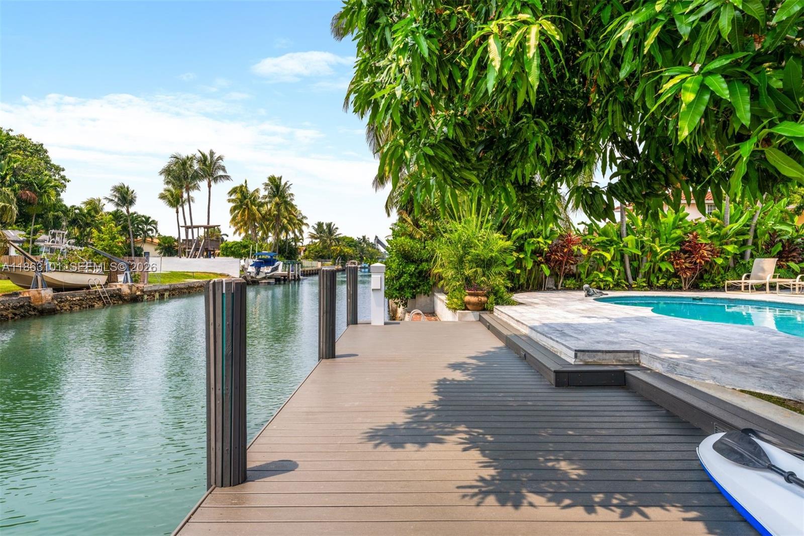This charming waterfront gem sits on guard-gated Biscayne Point—perfectly situated just minutes from the beach, restaurants and shops of the world class Bal Harbour. Thoughtfully renovated with impact windows, new roof, updated kitchen and baths, lush landscaping, pool and dock. A flexible additional space ideal for a home office, gym, or potential fourth bedroom. A serene retreat with modern comfort and timeless charm in one of Miami Beach’s most desirable neighborhoods.