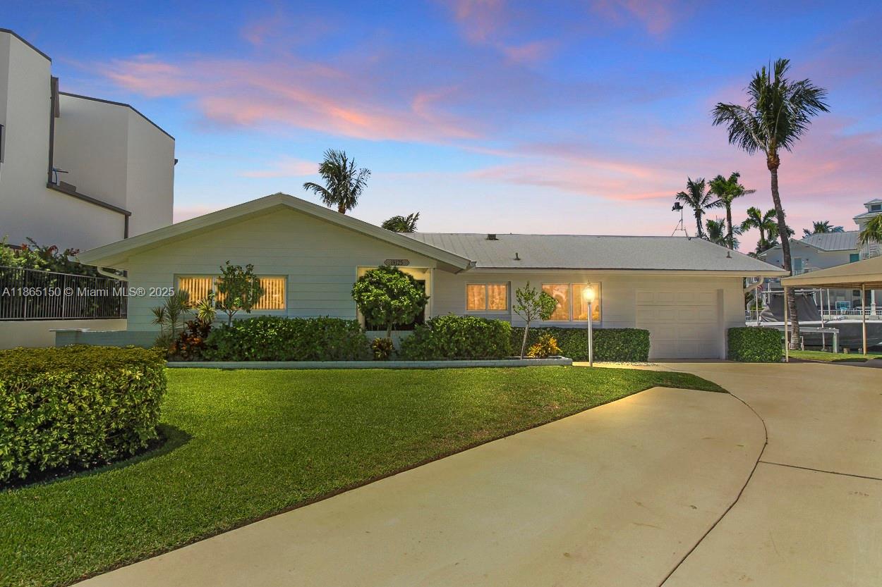 Rare Opportunity for this prime waterfront location minutes to the Jupiter Inlet with no fixed bridges! Situated on .35 acre corner lot with 123 ft plus of seawall this 3 bedroom / 2 bath pool home has endless possibilities.  Dock includes one 50 ft dock with composite decking 60 amp pedestal and a 15 ft dock with a 16k boat lift- all new electric dock wiring in 2025.  Updated Kitchen with granite countertops and stainless steel appliances , Hurricane Impact windows and doors.  Pool resurfaced in 2025 with new equipment & heater.  Truly a one of a kind oppurtinuty to own on the Jupiter Waterway !