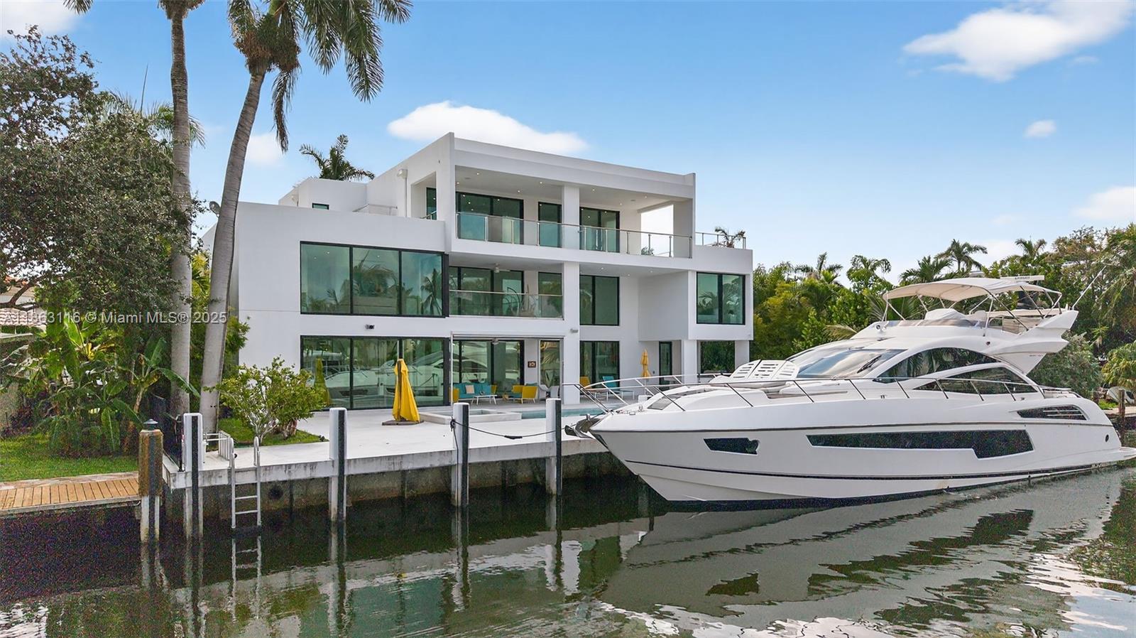 Ultra-modern new construction in Fort Lauderdale’s prestigious Las Olas Isles! This 3-story waterfront estate offers 8 en-suite bedrooms, soaring ceilings, open-concept living, and walls of glass for natural light throughout. Features include a premium stainless steel elevator, Miele appliances & Schuco windows/doors. The expansive 3rd-floor loft with bar opens to large terraces with stunning sunset views over downtown. Enjoy 100' of deepwater dockage with no fixed bridges—just minutes to the ocean. Outdoor highlights include a resort-style pool, summer kitchen, and a 3-car garage with lift capacity for 6. In the center of Las Olas dining, shopping, and beaches. A rare blend of luxury, location, and design!