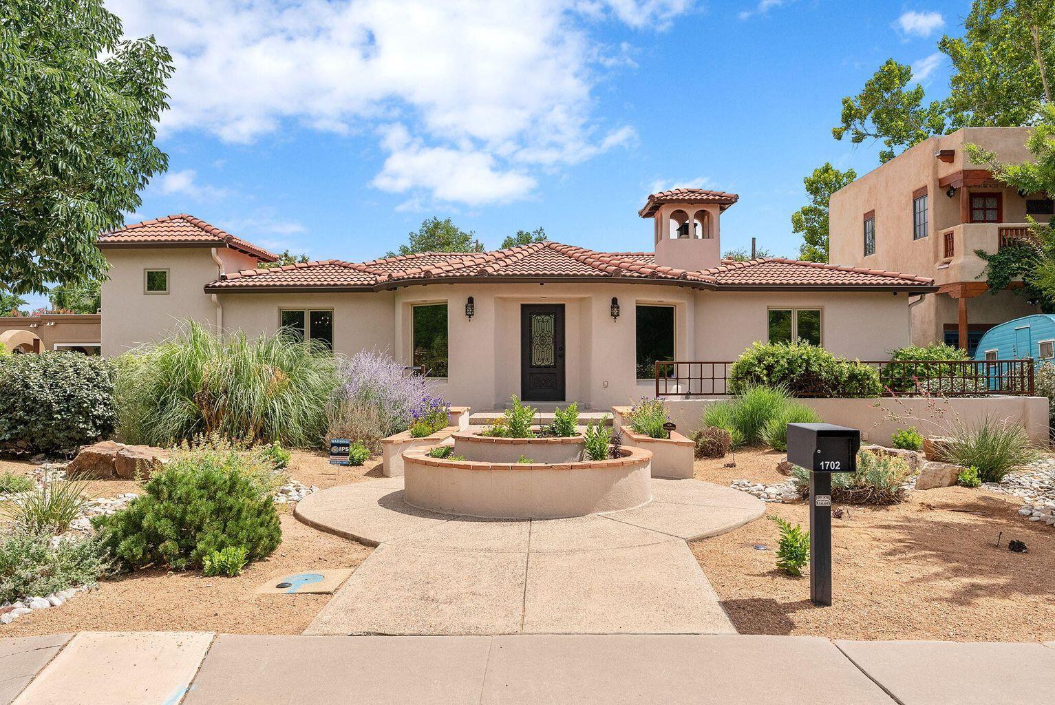Welcome to this beautifully re-imagined Tuscan-style residence in the prestigious Albuquerque Country Club. Enjoy the main living space with beautiful well maintained hardwood floors, spacious primary suite, 2 additional bedrooms or a home office, chefs kitchen w/custom cabinets & stainless steel appliances. The finished basement offers, plush new carpeting, an inviting entertainment room, and a stylish wet bar--perfect for hosting in style. Updates include: Pella windows, LED lighting, HVAC & mini splits. Detached 2 car garage & shed adds extra storage. Come experience its charm today!
