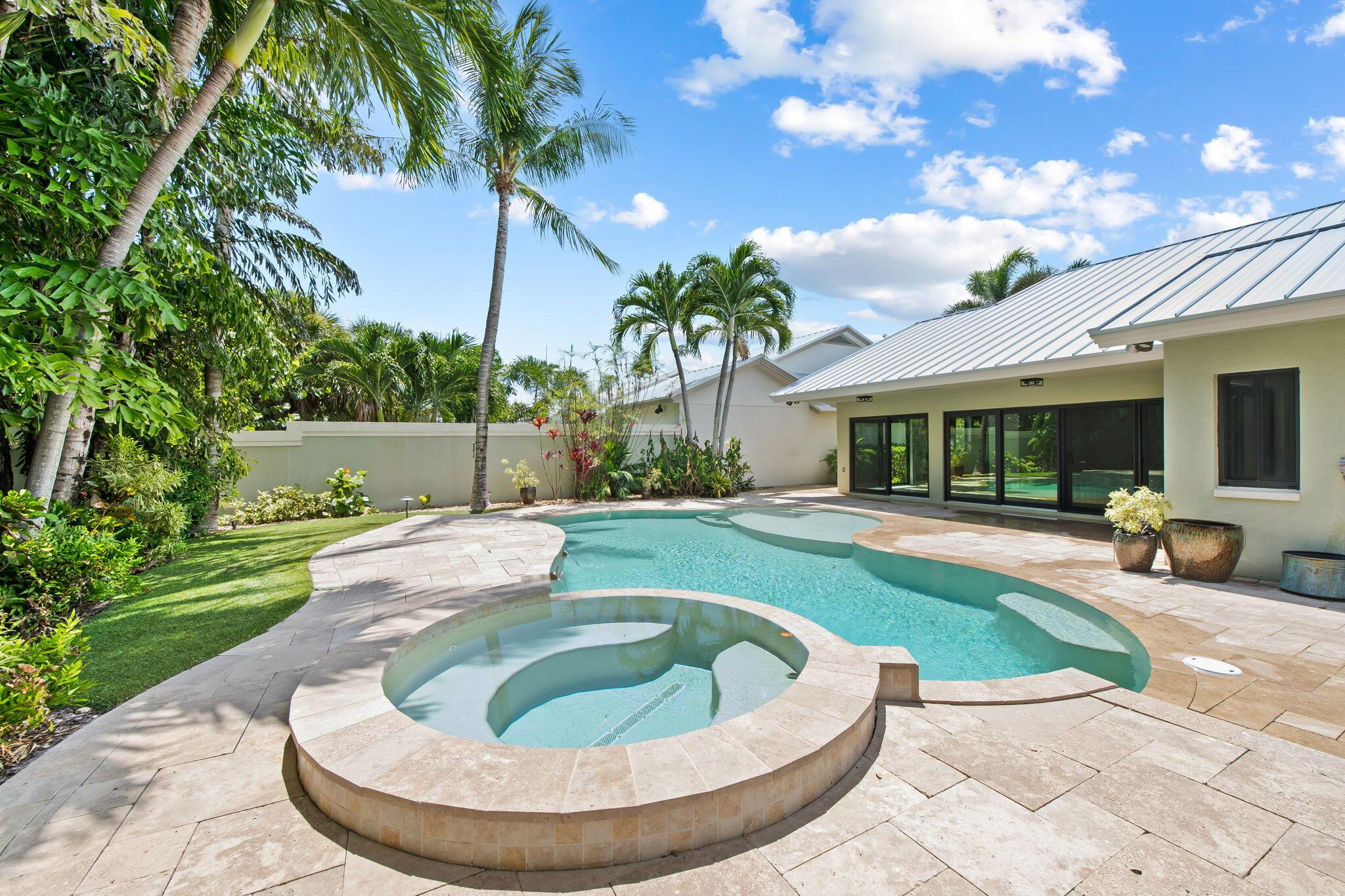 STEPS TO THE BEACH! This single-story home on an OVERSIZED LOT features a PRIVATE FREE-FORM SALTWATER POOL & SPA with MULTI-COLOR LIGHTING and a BACKYARD FACING EAST to capture refreshing SOUTHEAST OCEAN BREEZES with TOTAL PRIVACY--your own backyard Private Oasis just minutes away from the ocean.  Major updates include NEW METAL ROOF WITH 30 YEAR WARRANTY, IMPACT WINDOWS & DOORS, and a NEW HURRICANE GARAGE DOOR. Inside, enjoy VAULTED CEILINGS, SPLIT FLOOR PLAN, 3 BEDROOMS & 2 BATHS, and a chef's kitchen with WOOD CABINETS, GRANITE COUNTERTOPS & STAINLESS-STEEL APPLIANCES. Community offers CLUBHOUSE, TENNIS & PICKLEBALL, plus an active social lifestyle-all in The Ridge at the Bluffs, one of Jupiter's most sought-after neighborhoods. 141 Sand Pine Drive - Florida coastal living at its best STEPS TO THE BEACH! This single-story home on an OVERSIZED LOT features a PRIVATE FREE-FORM SALTWATER POOL &amp; SPA with MULTI-COLOR LIGHTING and a BACKYARD FACING EAST to capture refreshing SOUTHEAST OCEAN BREEZES with TOTAL PRIVACY&#x14;your own backyard Private Oasis just minutes away from the ocean. 
Major updates include NEW METAL ROOF WITH 30 YEAR WARRANTY, IMPACT WINDOWS &amp; DOORS, and a NEW HURRICANE GARAGE DOOR. Inside, enjoy VAULTED CEILINGS, SPLIT FLOOR PLAN, 3 BEDROOMS &amp; 2 BATHS, and a chef's kitchen with WOOD CABINETS, GRANITE COUNTERTOPS &amp; STAINLESS-STEEL APPLIANCES. Community offers CLUBHOUSE, TENNIS &amp; PICKLEBALL, plus an active social lifestyle&#x14;all in The Ridge at the Bluffs, one of Jupiter's most sought-after neighborhoods. 
141 Sand Pine Drive - Florida coastal living at its best.