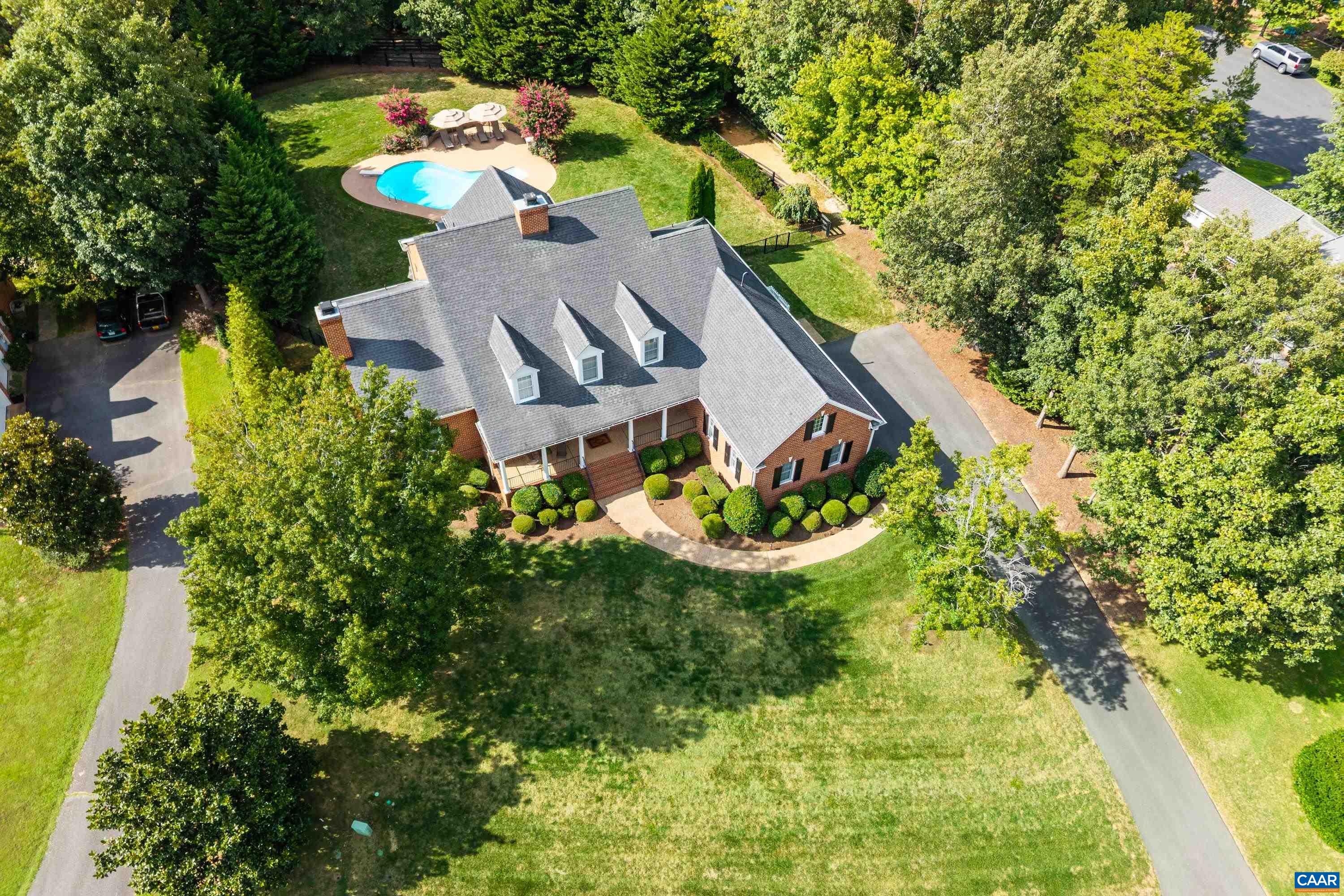 The timeless elegance found in GLENMORE is beautifully reflected in this stunning 4 bedroom Keswick residence set upon a 3/4 acre elevated homesite. Lush manicured grounds surround this meticulously maintained home. Two Primary suites, two fireplaces, three car garage and a modern culinary kitchen & pantry. Exclusive random width distressed oak flooring and staircase by Mountain Lumber found throughout. The resort style salt water pool is simply gorgeous and is surrounded by mature & lofty trees that offer four season privacy. Exquisite covered patio is an entertainer's dream. Irrigation system encircling the home, whole house generator and newly paved driveway. See Documents for a detailed list of features.