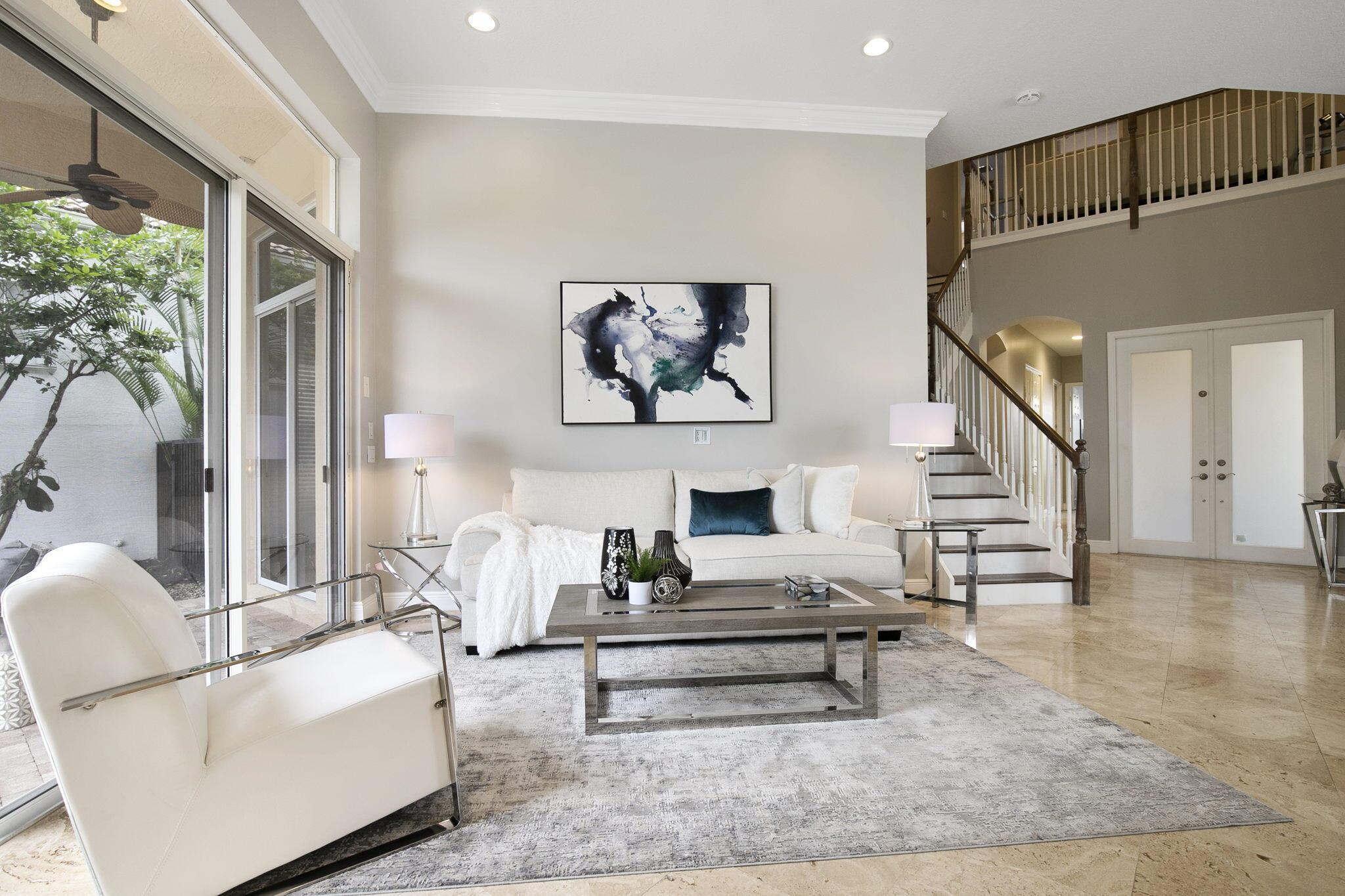 Updated modern with sweeping water views, 4 bdrm, study and 2nd level loft home, in Mirasol Country Club Community. Bright and open floor plan with living, dining, main level Primary suite, main level guest suite, office and family room open to the kitchen.  2nd level loft with 2 bedrooms and bath. Spacious patio surrounded by lush landscaping, inviting pool and spa perfect for relaxing and entertaining. Enjoy Sport Membership Privileges at Mirasol Country Club with two champion golf courses, state of the art practice range and facilities, 15 clay tennis courts, full-service spa, aquatics center, fitness center, family sports complex, walking and biking, grand