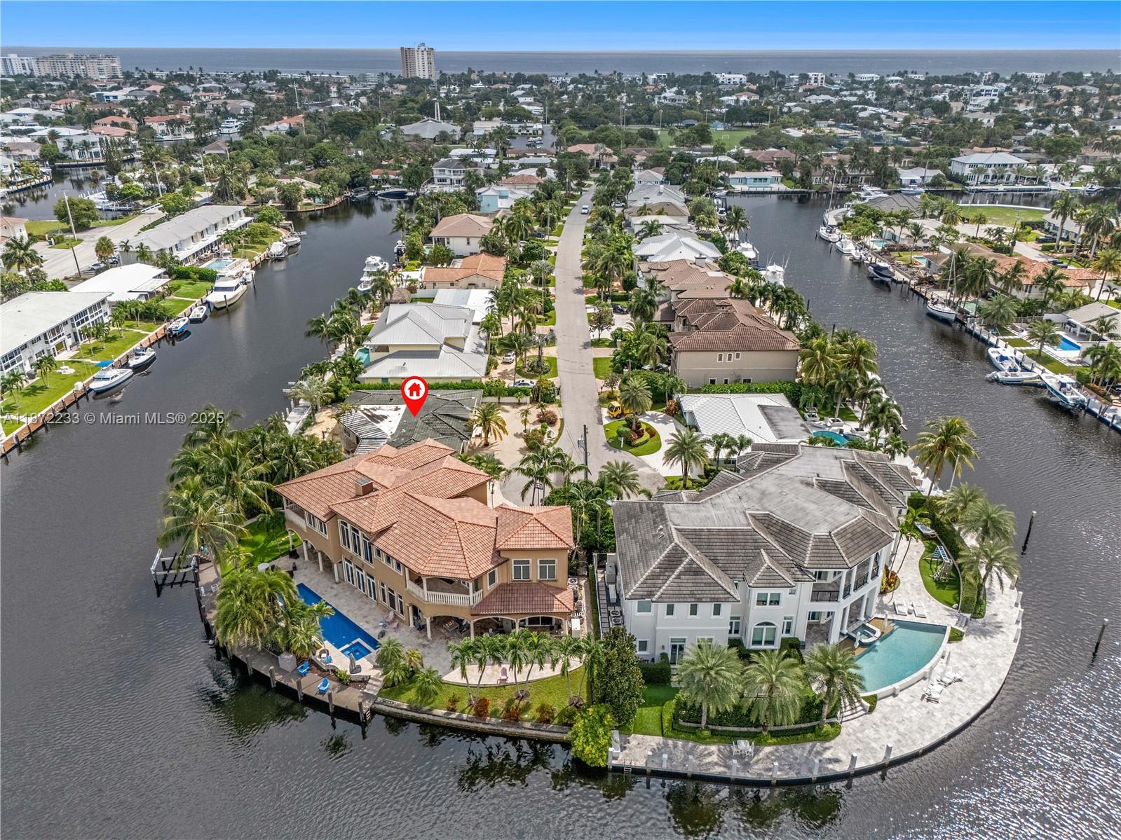 97 Feet Waterfront – No Fixed Bridges – Lighthouse Point Tear-DownUnmatched opportunity on NE 35th Street: 97 feet of deep-water frontage with no fixed bridges and direct ocean access. Oversized ~9,939 sf lot with existing pool offers the perfect canvas for a luxury two-story custom home (3,500–4,000+ sf). Surrounding sales support new construction values of $3M–$4M+. The existing 1962 residence is sold as-is, land value only. This is a boater’s paradise location with a scarce supply. No contingencies.