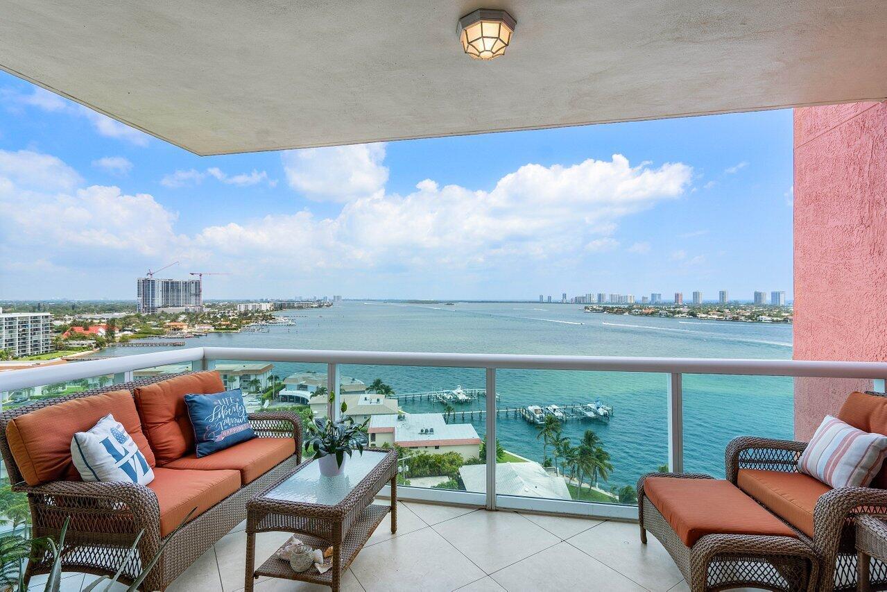 Beautifully updated 14th floor END UNIT w/2BR + den, 2BA overlooking the Intracoastal, impact glass, semi-private elevator access. Open concept, split floor plan with spacious owners suite w/his & her walk-in closets. Amazing primary bathroom w large walk in shower, glass enclosure, modern finishes with a spa like feel! New doors throughout, neutral paint & fully tiled. plantation shutters & a newer A/C unit! Assigned garage parking & climate-controlled storage unit. 24/7 manned gate, valet. Newly renovated rooftop oasis w/pool, spa, BBQ areas, tennis/pickleball. Walking path w/gazebo, clubhouse, billiard room & fitness center. Adjacent marina w/dry docks available, minutes to ocean; no fixed bridges! Pet friendly & social community. Seller will consider 50% seller financing, up to 3 yrs