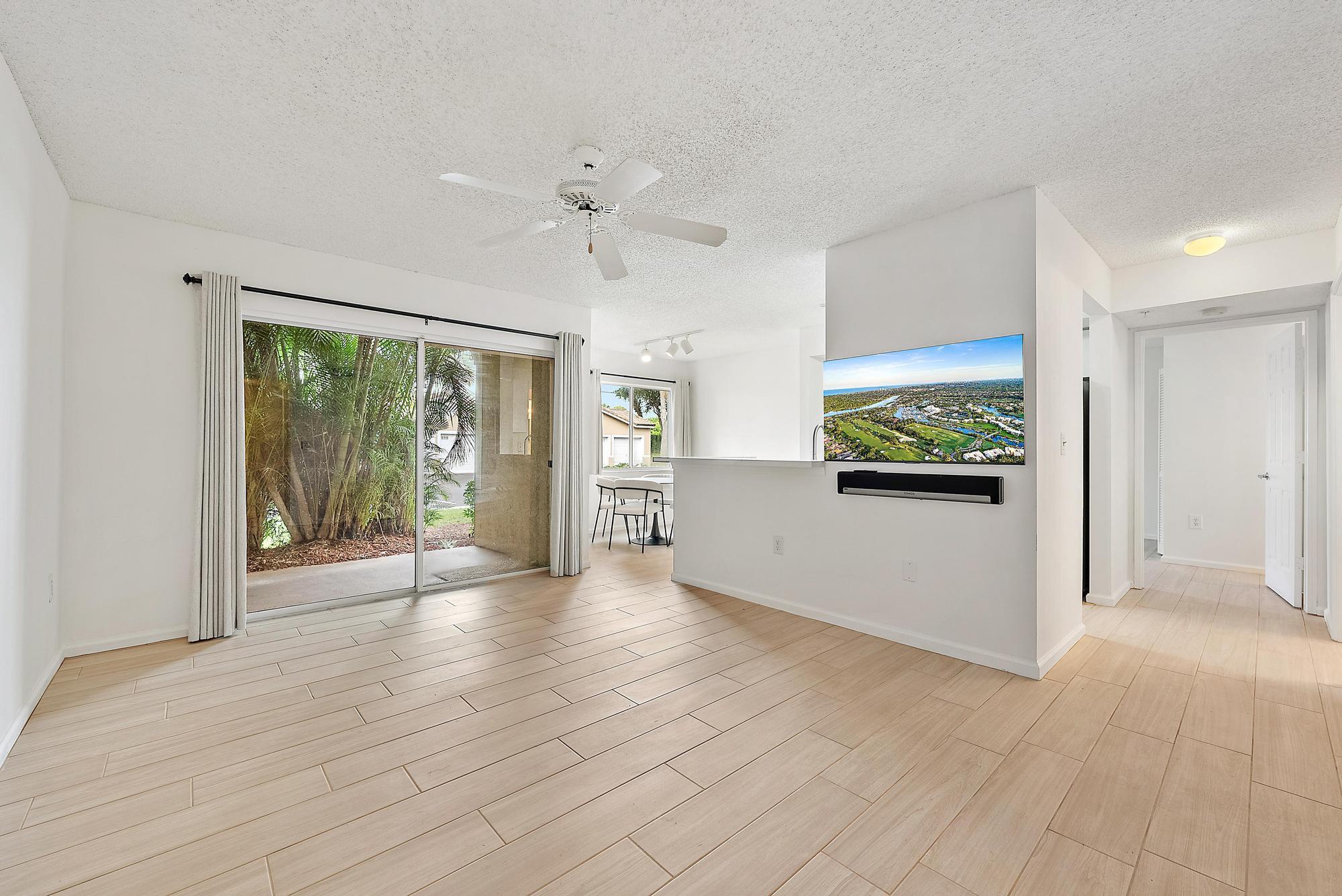 Welcome to this beautifully updated first-floor condo in the highly desirable Lighthouse Cove. With parking conveniently located right outside your door, this residence offers both comfort and ease of living. Inside, you'll find upgrades throughout, including full porcelain tile flooring, new quartz countertops and sinks in the kitchen and bathroom, updated plumbing, and more. Major systems have also been recently replaced with an A/C (2023) and water heater (2022).Lighthouse Cove offers resort-style amenities with a pool, clubhouse, fitness center, tennis courts, and more. Located in the heart of Tequesta, you'll enjoy close proximity to beautiful beaches, golf courses, dining, shopping.  This move-in-ready condo is perfect for year-round living, a seasonal getaway, or investment.