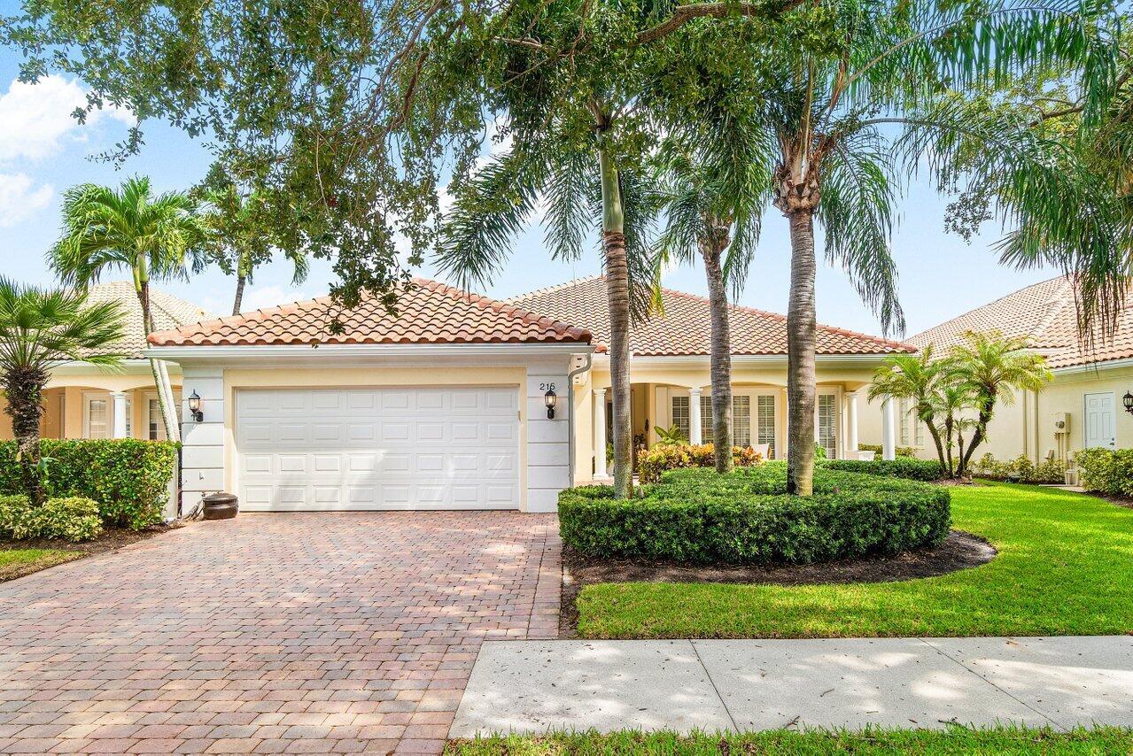 Enjoy peaceful lake views from this immaculately maintained Carlyle model, on a quiet cul-de-sac in the coveted Isles at Palm Beach Gardens. Upgrades include a new roof (Aug 2025), baths with marble top vanities & nickel finishes, partial impact windows/impact garage door. With its inviting front porch, this light-filled 4BR/3BA home features formal and informal living areas, soaring ceilings, diagonal porcelain tile, and a screened-in lanai perfect for outdoor relaxation. The 4th bedroom is set up as a home office with custom built-ins. The spacious kitchen with granite counters and abundant cabinetry flows seamlessly into the family room. Large primary suite offers dual baths and generous closets. Pristine 2 car garage and laundry.  Enjoy resort-style amenities including pool, tennis,