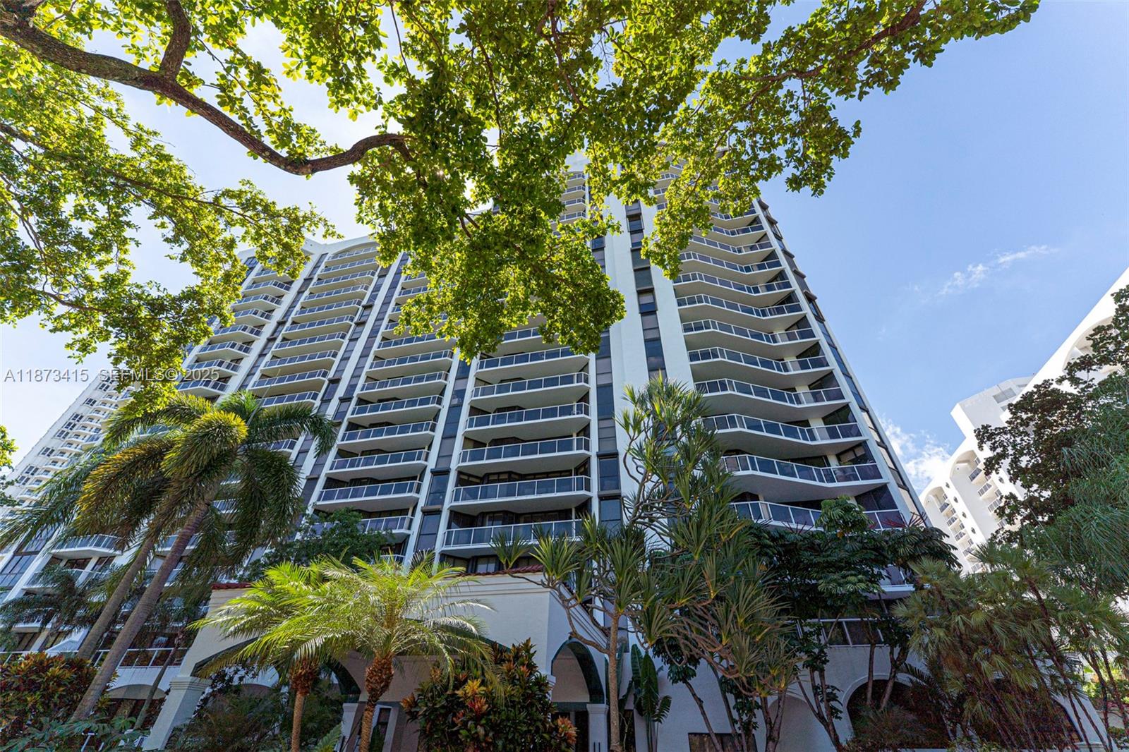 Beautiful Corner apartment, features elegant parquet flooring throughout and offers a bright living room filled with natural light, along with a dining area ideal for hosting family gatherings. The kitchen includes a charming breakfast nook, perfect for casual meals. A spacious balcony, accessible from every room, enhances the home’s appeal.The property also includes two covered parking spaces. Amenities include: 2 heated swimming pools, spa/sauna, and hot tubs, Tennis courts, fitness center Clubhouse, party room, children’s playroom Library, business center, hobby room and movie theater, 24-hour security, gated access, valet parking, and concierge services.